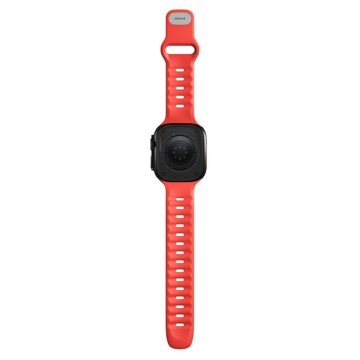 Una correa roja Nomad está unida a un Apple Watch negro. La esfera del reloj no es visible.