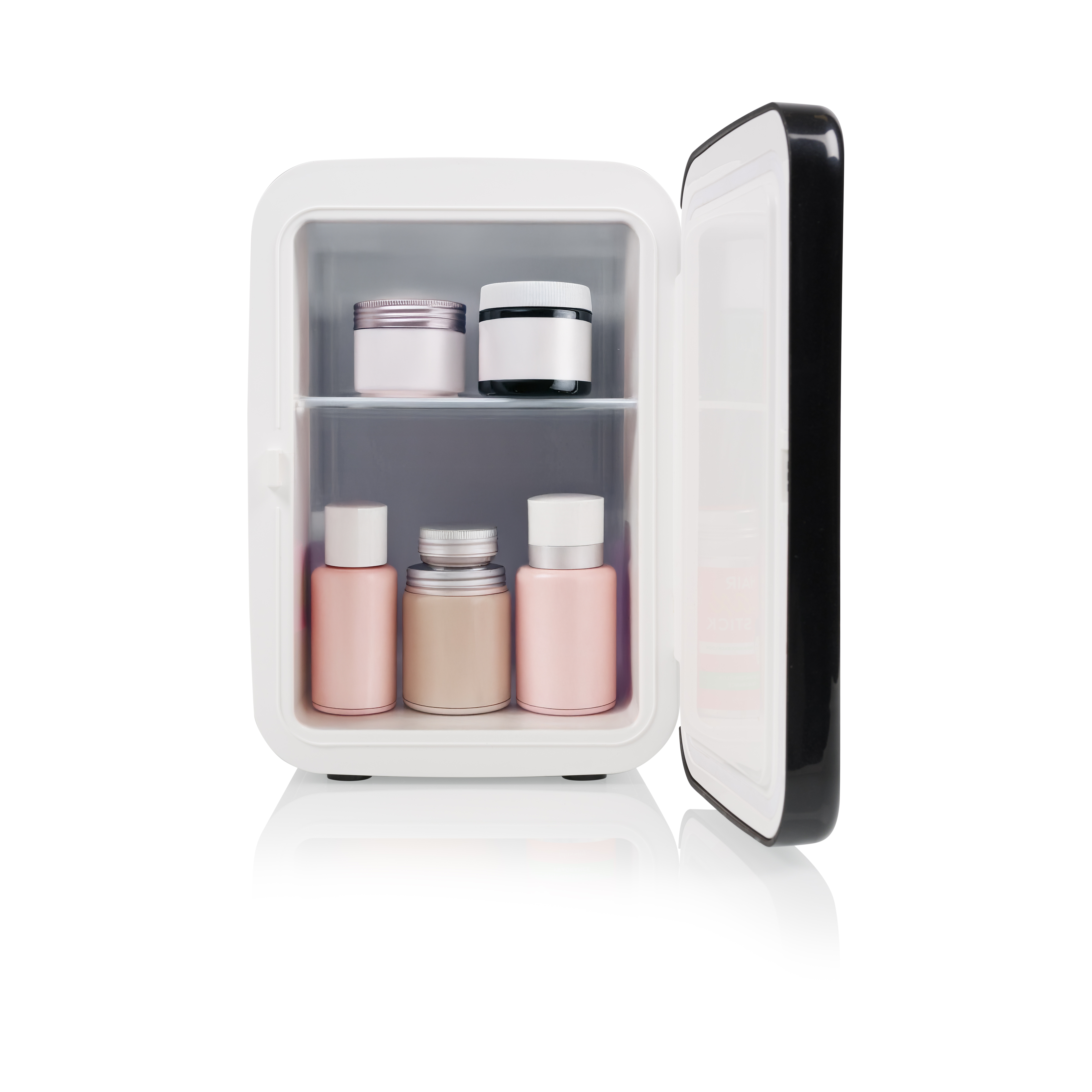 A small white mini-fridge stocked with skincare bottles and jars.
