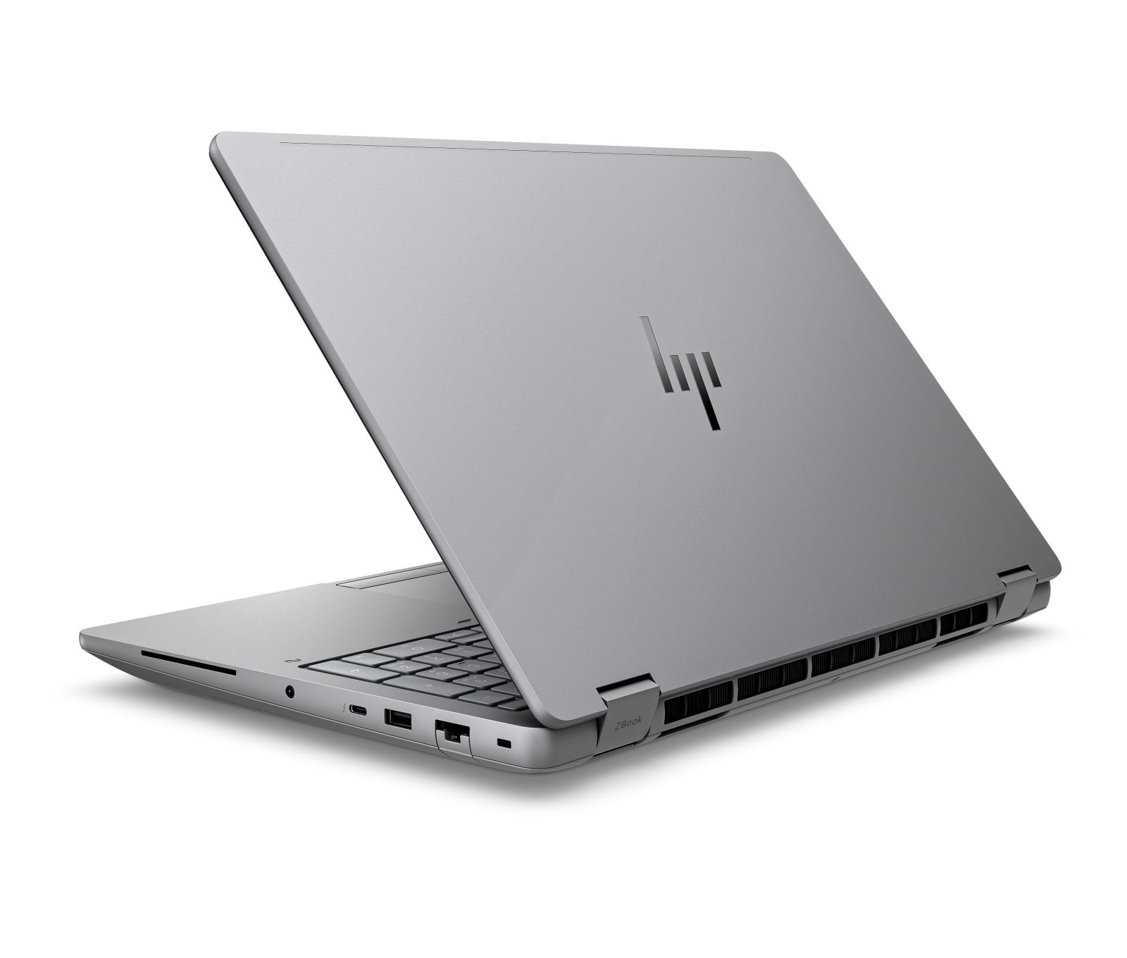 Srebrny laptop HP z zamkniętą pokrywą, na białej powierzchni.