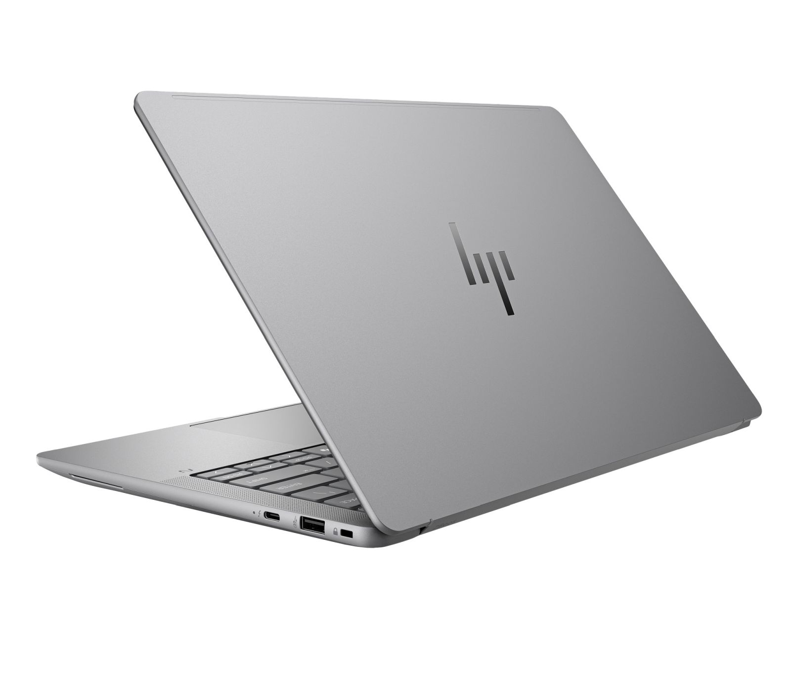 Srebrny laptop HP, częściowo otwarty, z widoczną klawiaturą i portami.