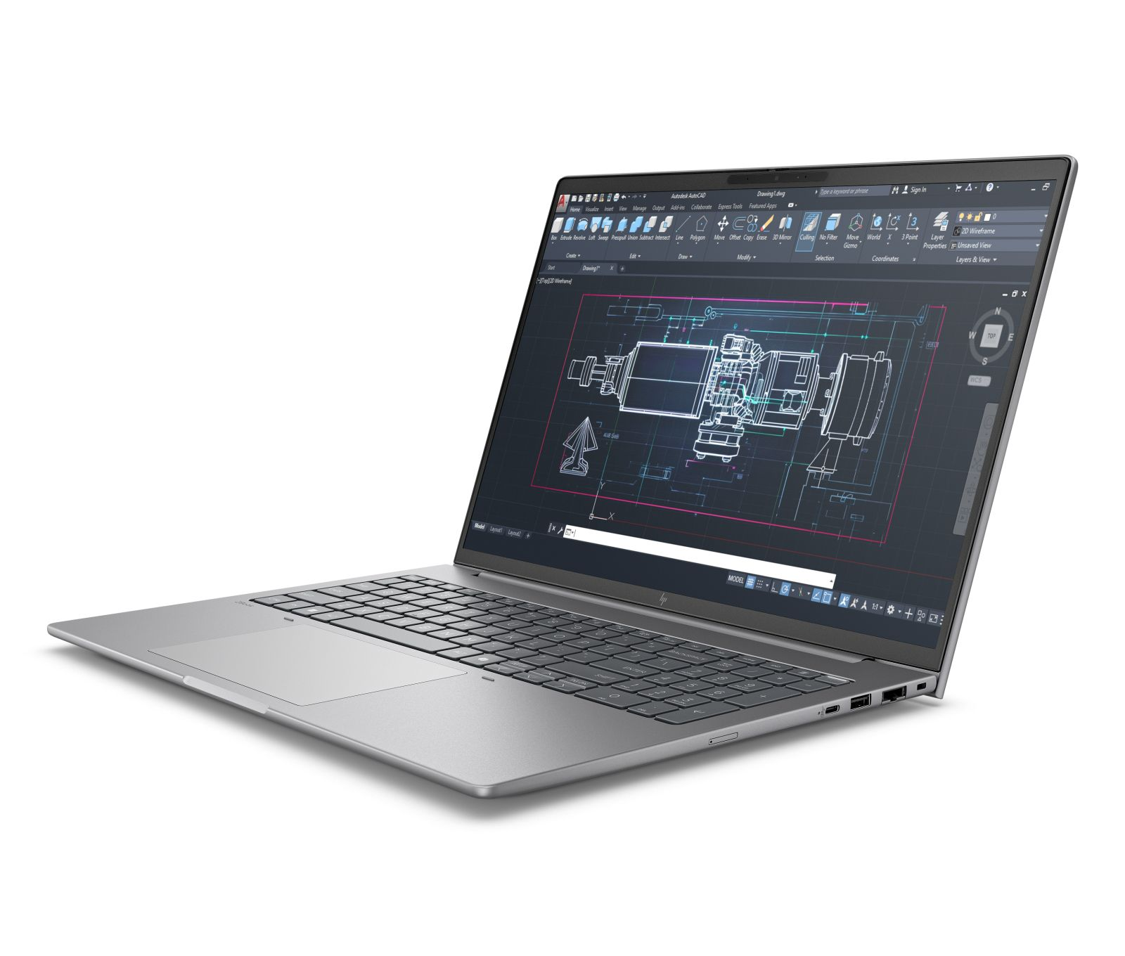 Srebrny laptop wyświetla plan AutoCAD na ekranie. Białe tło.