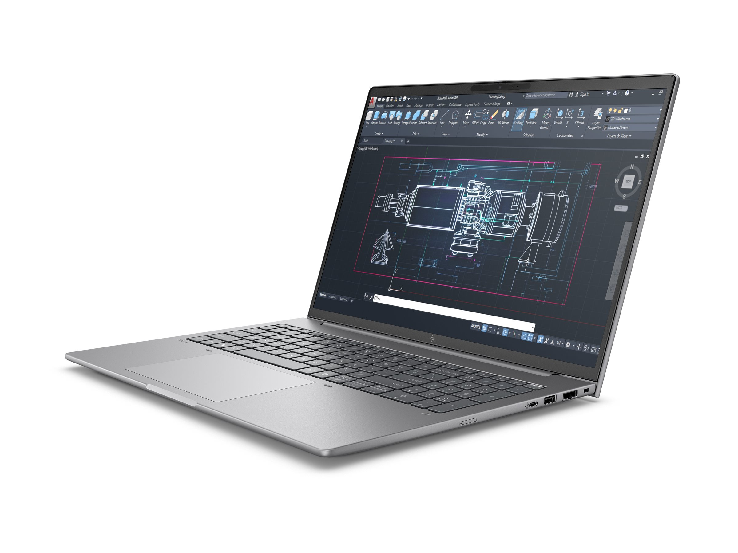 Srebrny laptop wyświetla złożony rysunek techniczny na ekranie, oprogramowanie CAD.
