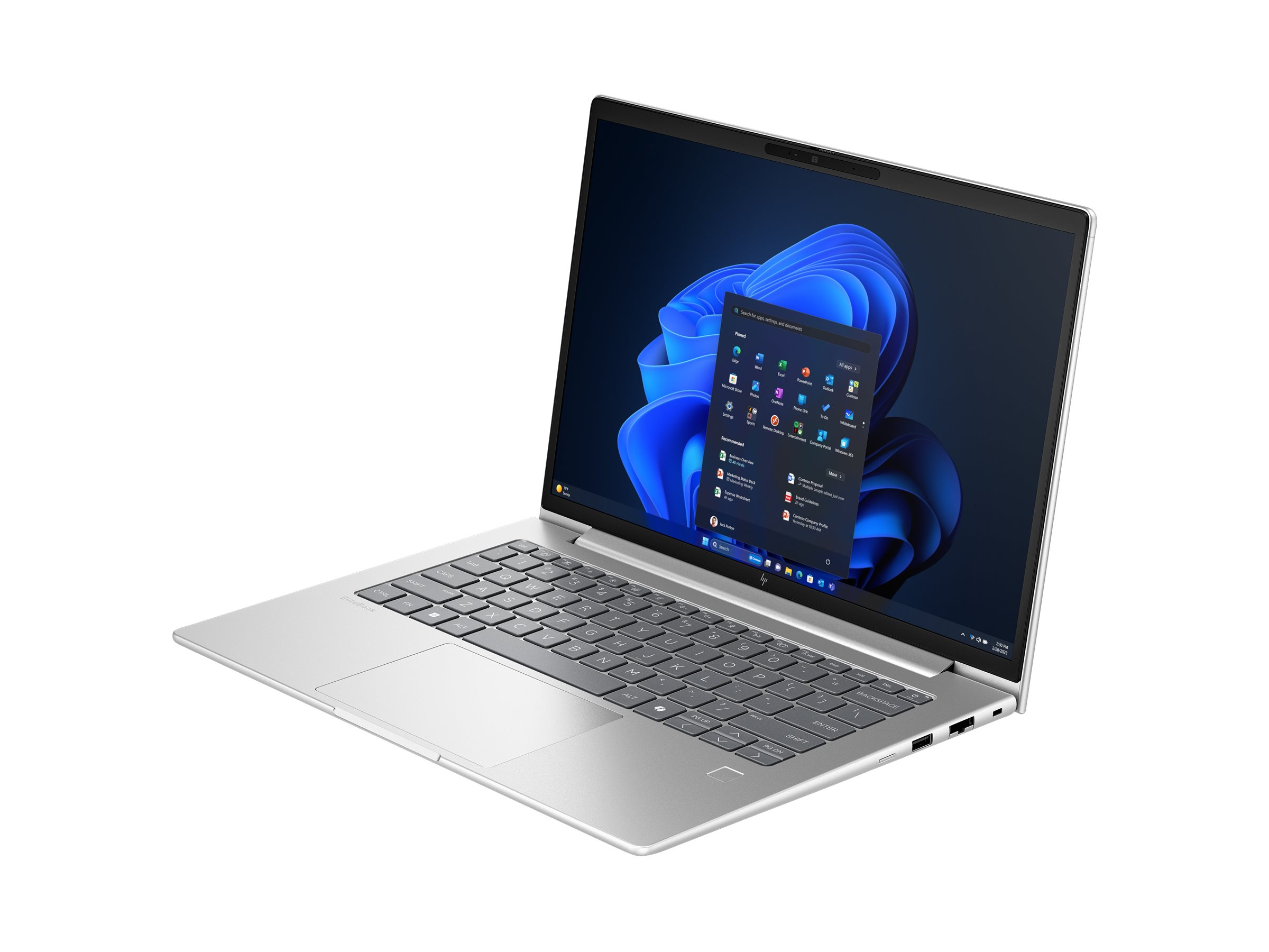Un laptop argentato con lo schermo aperto, che mostra Windows 11 e una barra di ricerca.