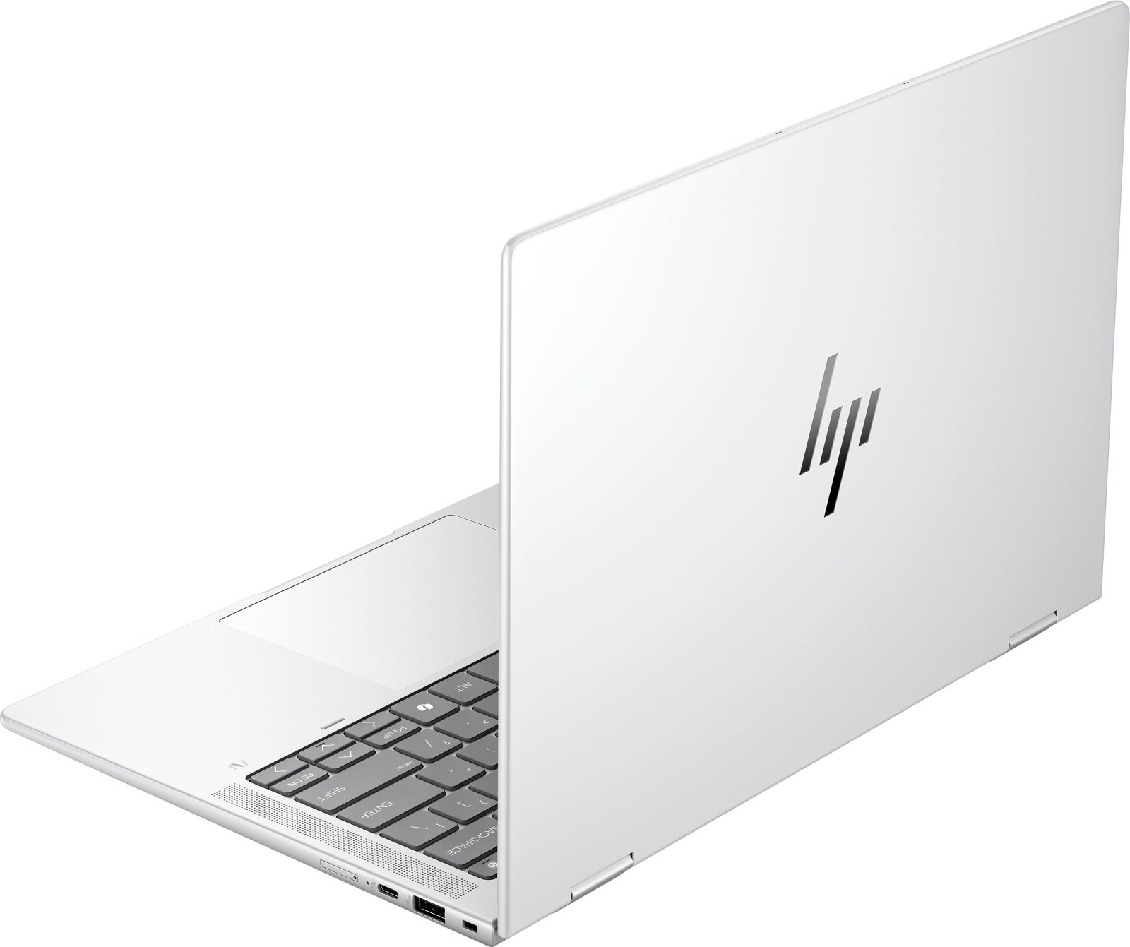 Biały laptop HP jest otwarty, widać klawiaturę i część ekranu.