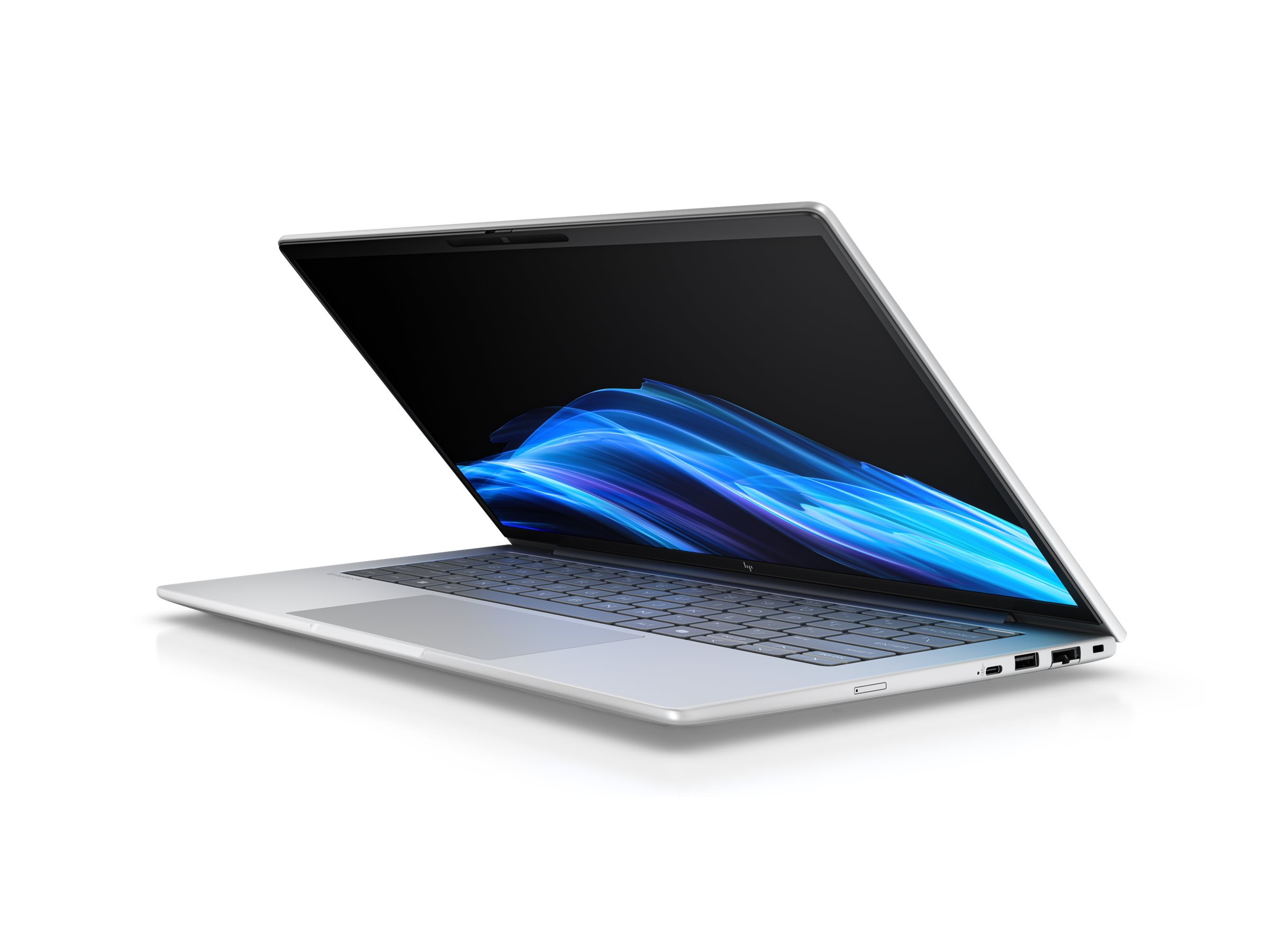 Un laptop argentato con lo schermo aperto, che mostra un motivo astratto blu.