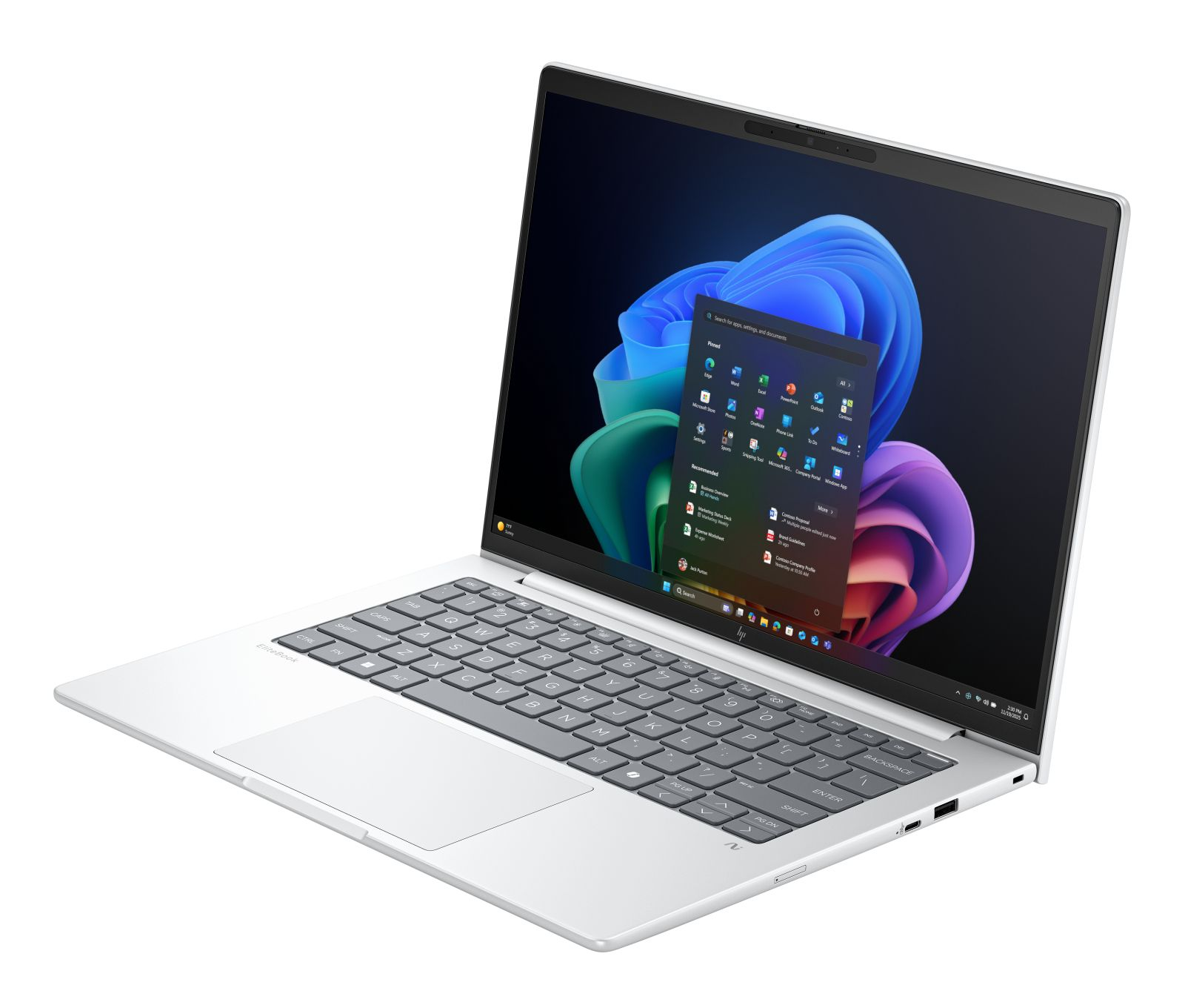 Srebrny laptop z otwartym ekranem, wyświetlający menu Windows.