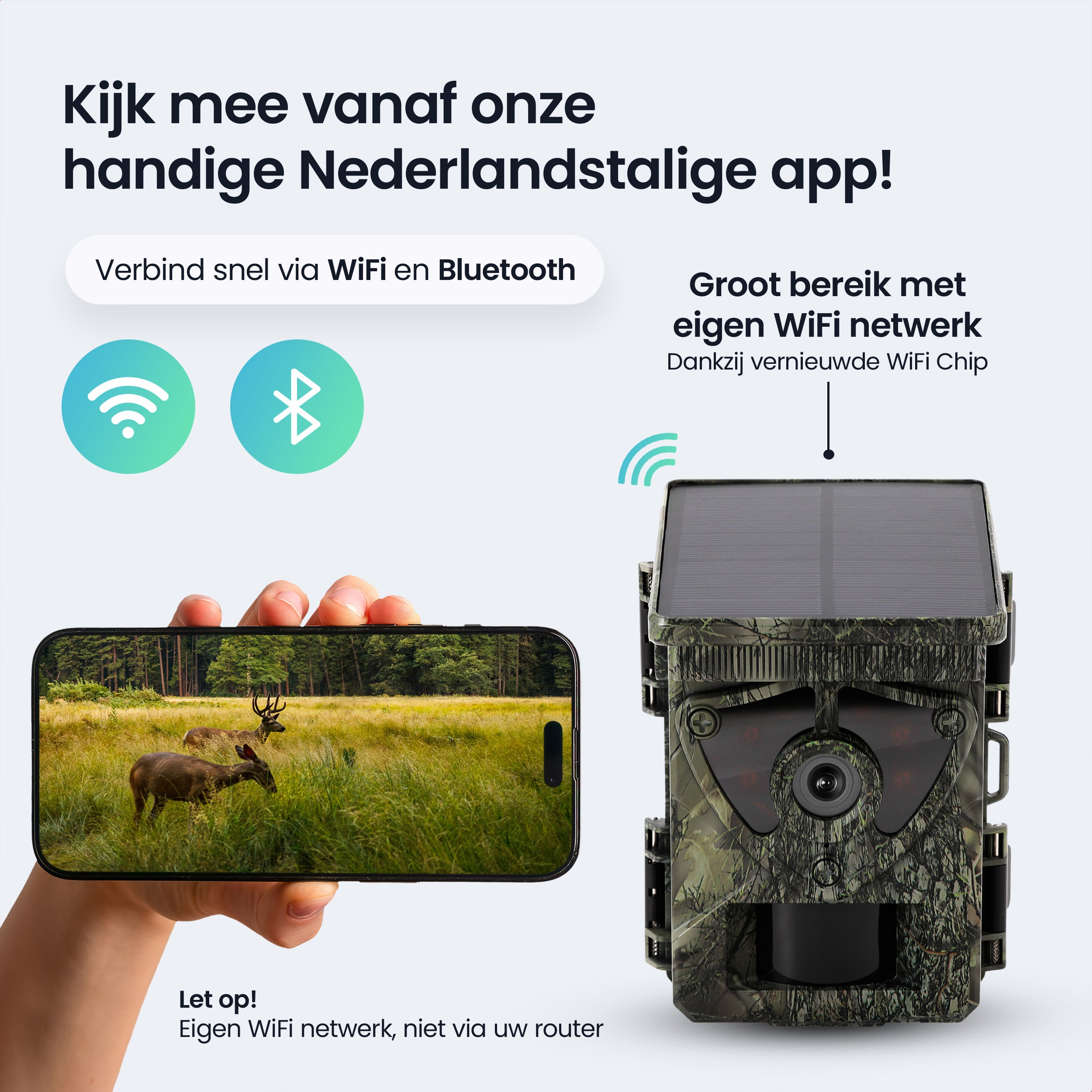 Trail camera with solar panel, phone showing deer in grassy field.