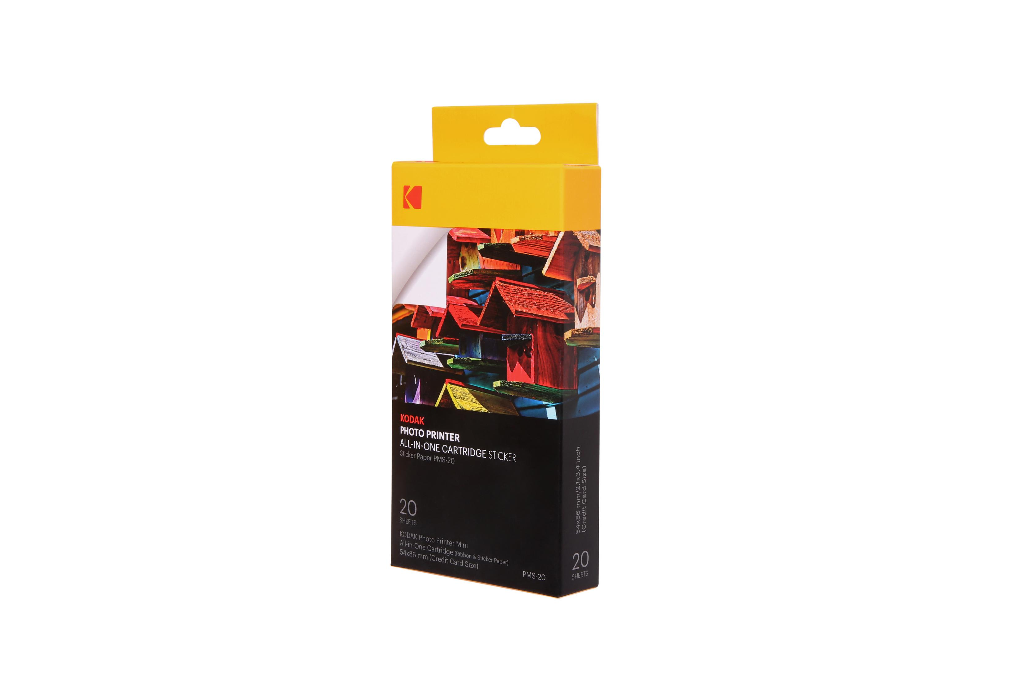 Caja de papel adhesivo para impresora fotográfica Kodak, con tapa amarilla, muestra casas de pájaros coloridas.