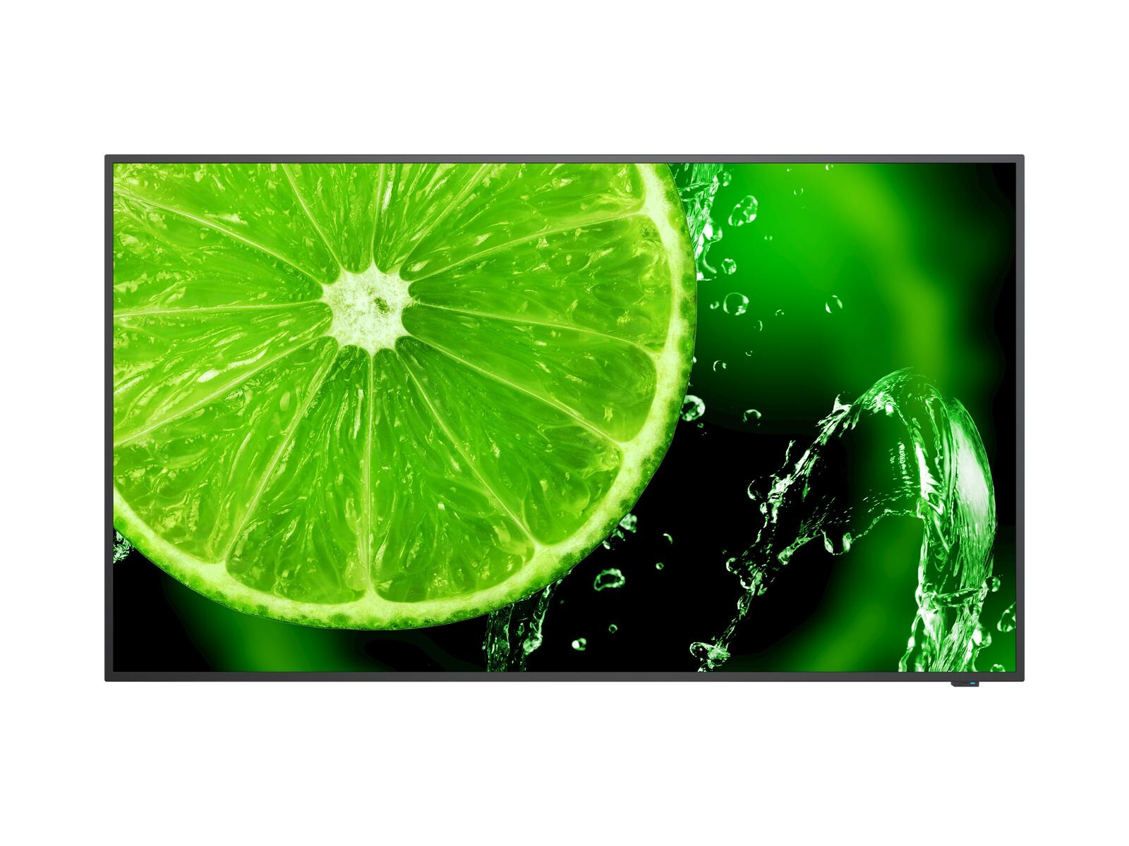 Una fetta di lime verde brillante con acqua che schizza attorno su sfondo scuro.