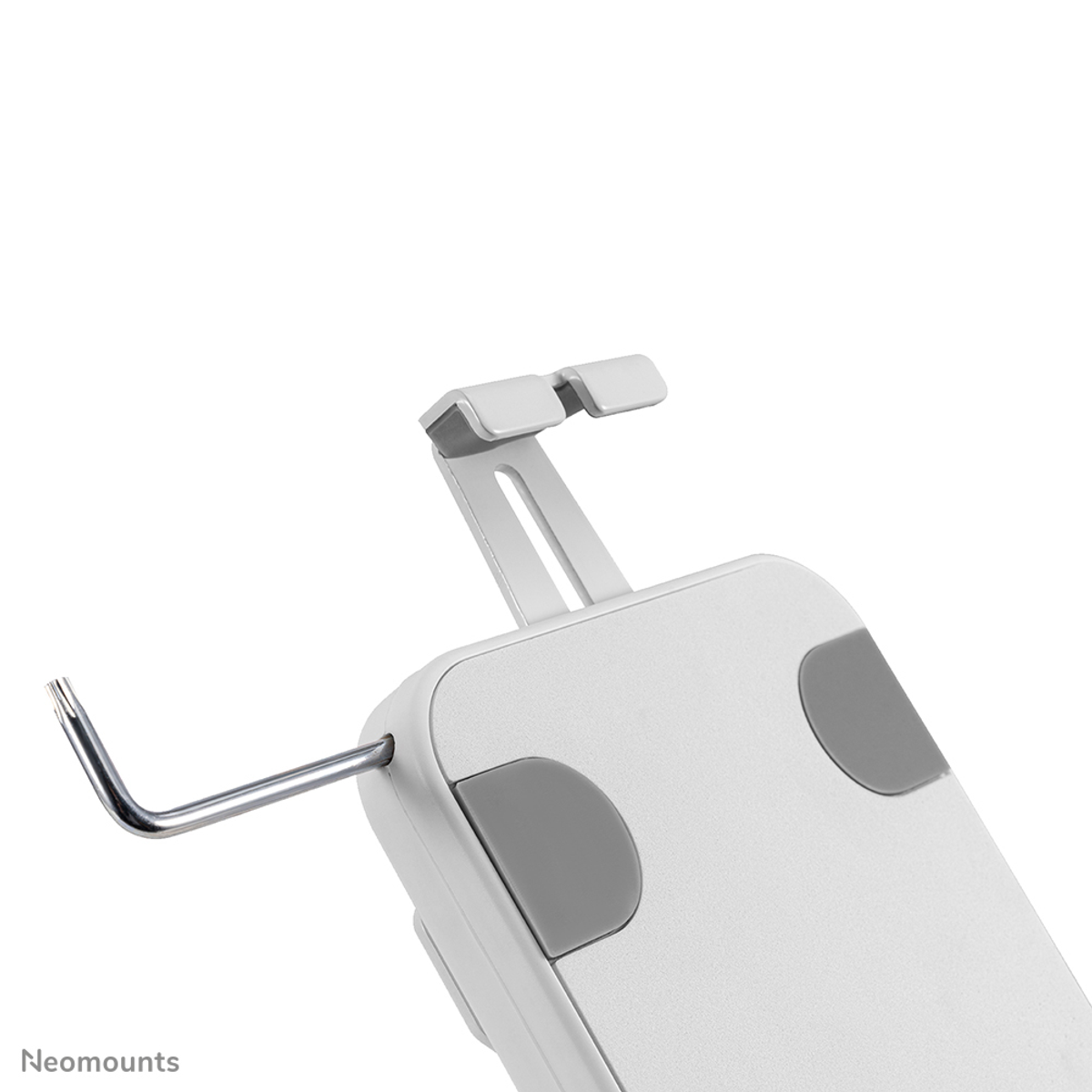 Primo piano di un supporto per telefono bianco con cuscinetti in gomma grigi e uno strumento a L.