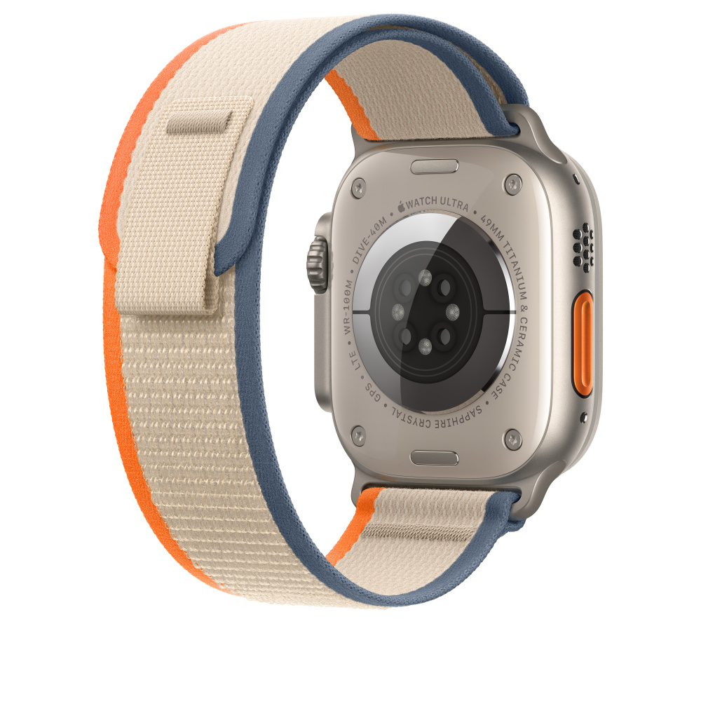 A silver Apple Watch Ultra with a beige, blue, and orange band is shown.