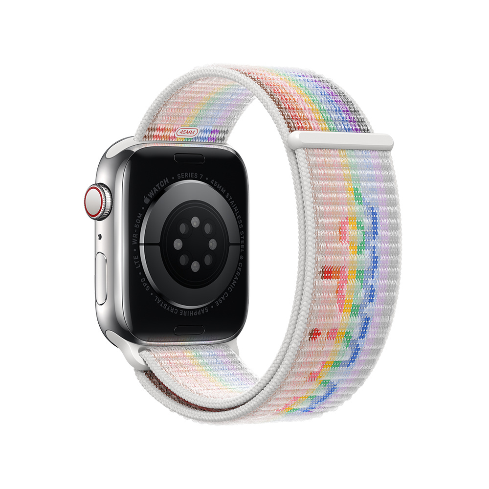 A silver Apple Watch Series 7 with a rainbow-striped sport loop band on a white background.