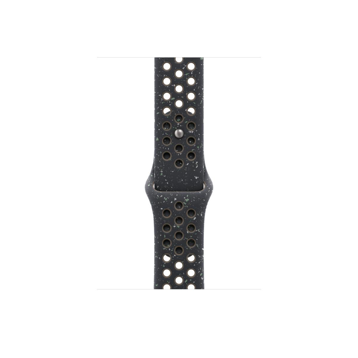 A dark watch band with many small holes, showing a speckled texture.
