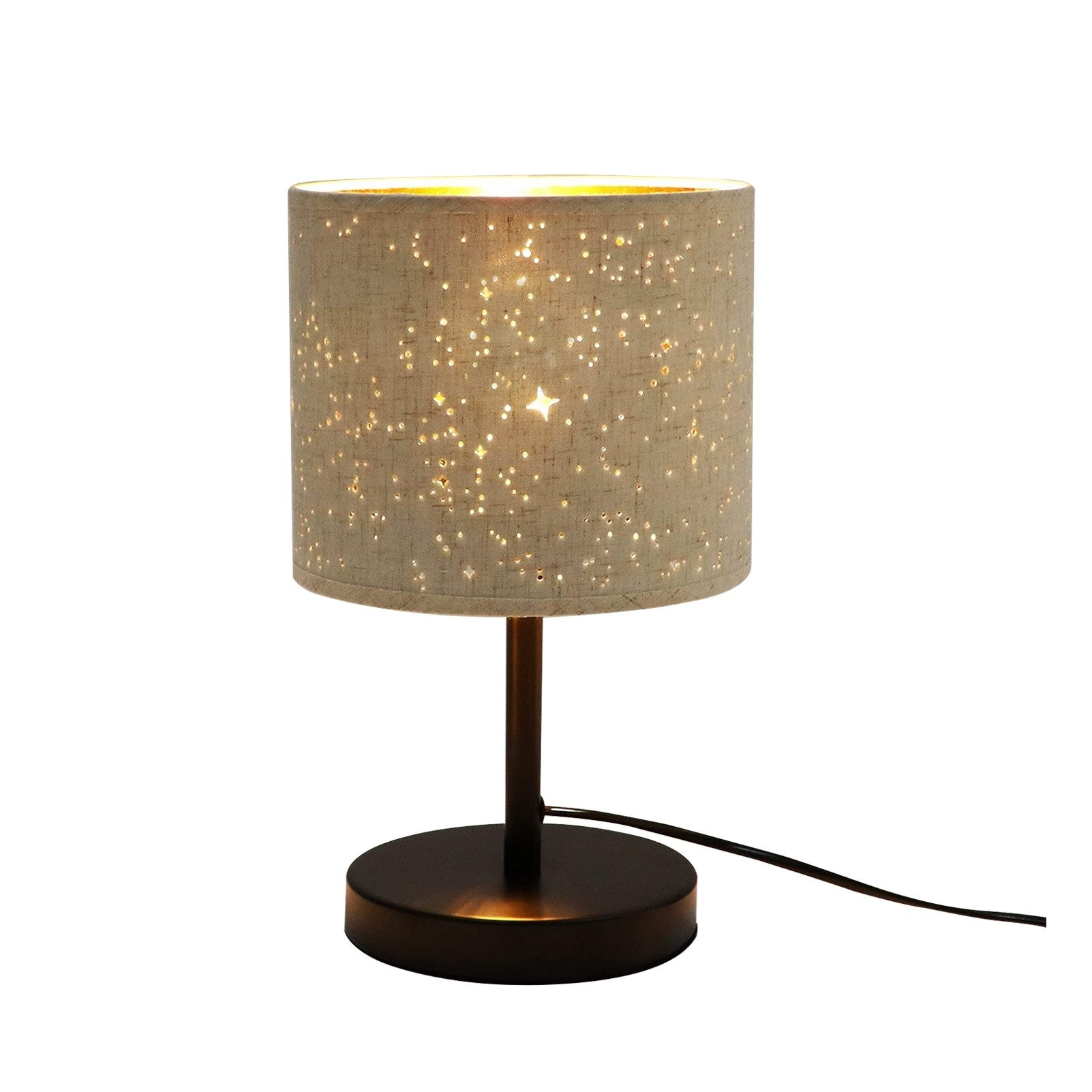 Lampada da tavolo con paralume in tessuto a fantasia di stelle e base scura.