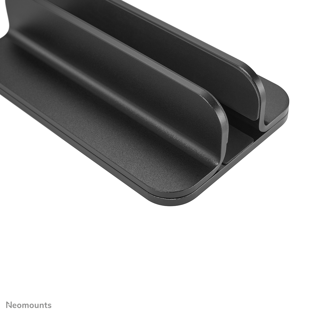 Close up of a black laptop stand with two slots.
