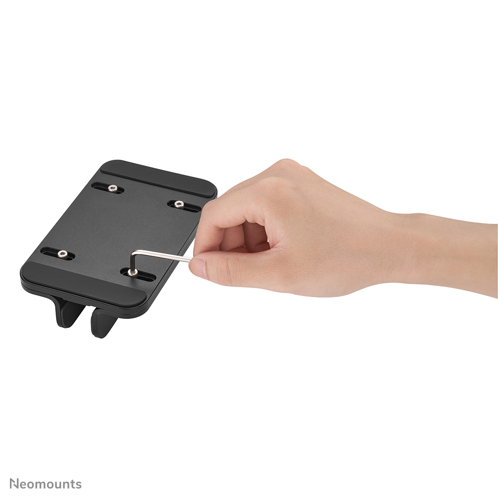 A hand uses a hex wrench to tighten a screw on a black mount.