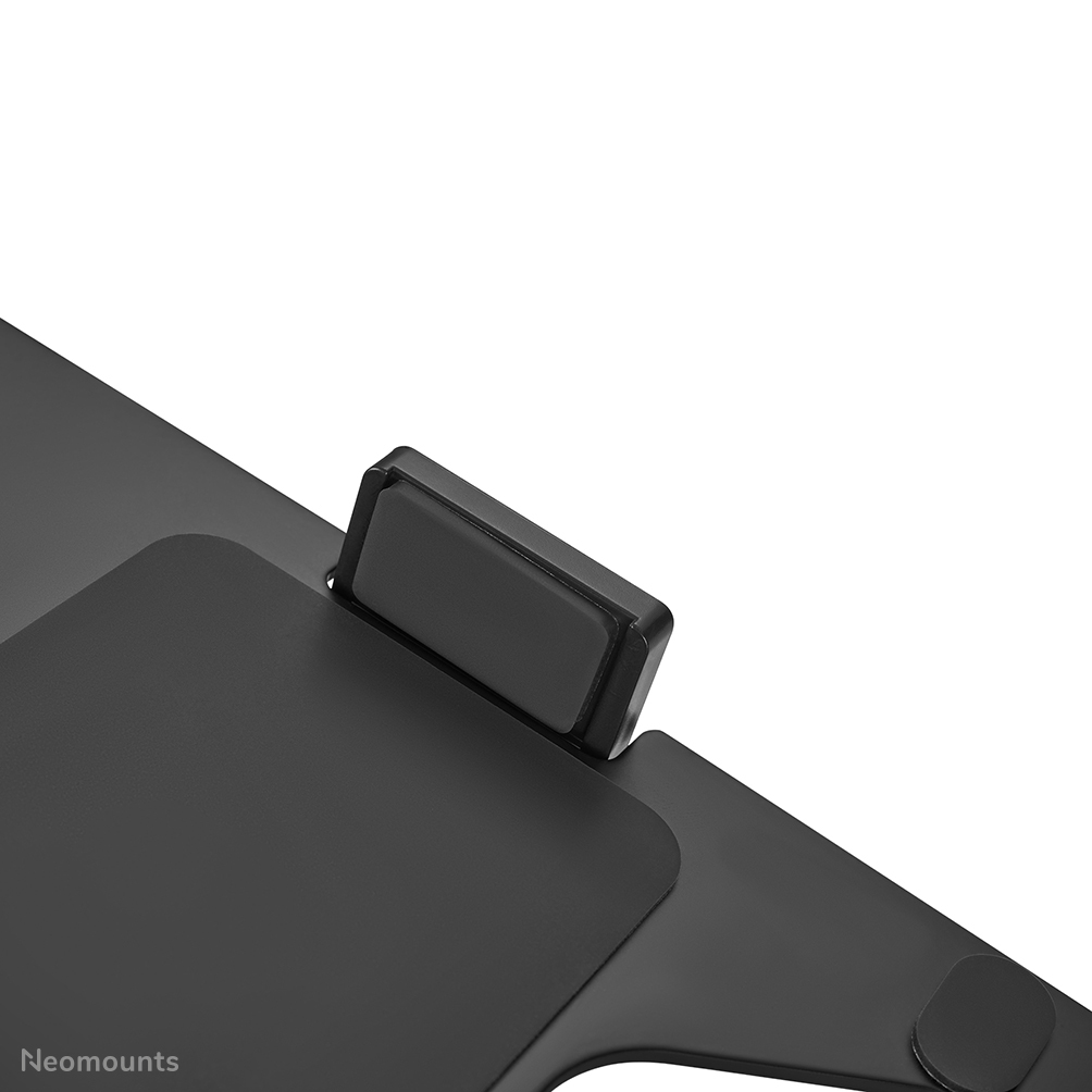 A black Neomounts stand with a gray rubber grip for stability.