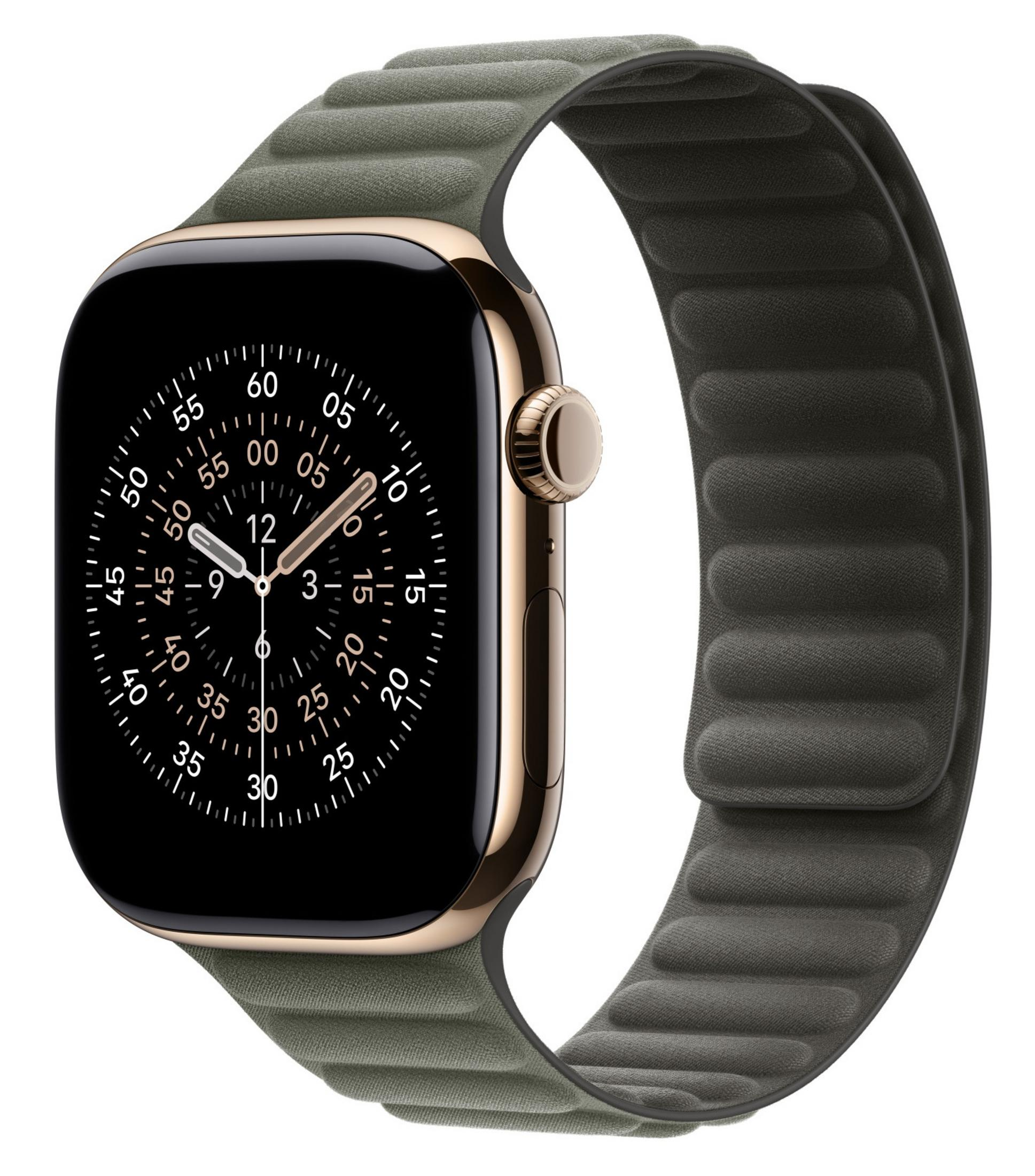 Apple Watch dorada con banda verde y esfera negra mostrando un reloj.