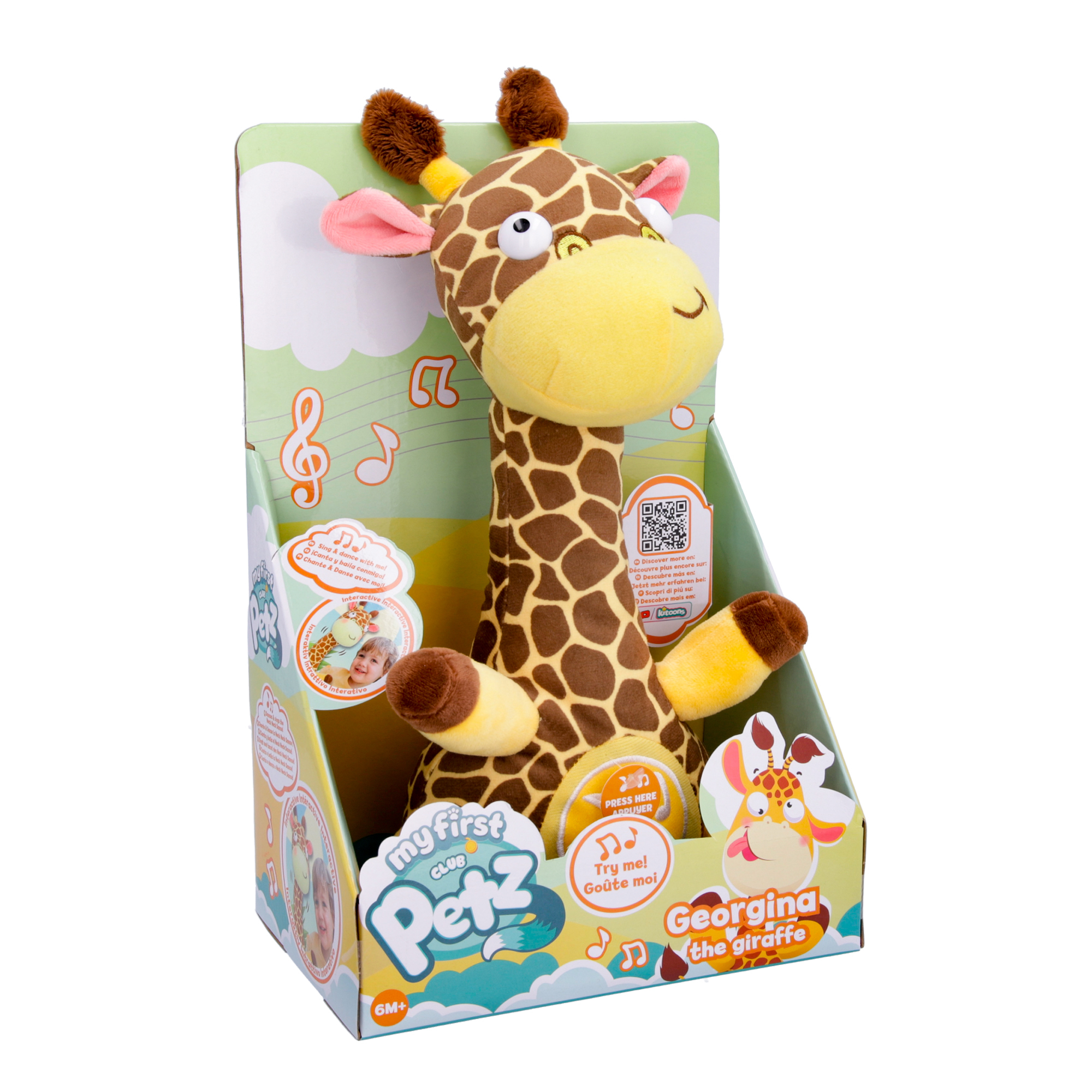 Un giocattolo giraffa di peluche nella sua scatola con note musicali e nuvole.