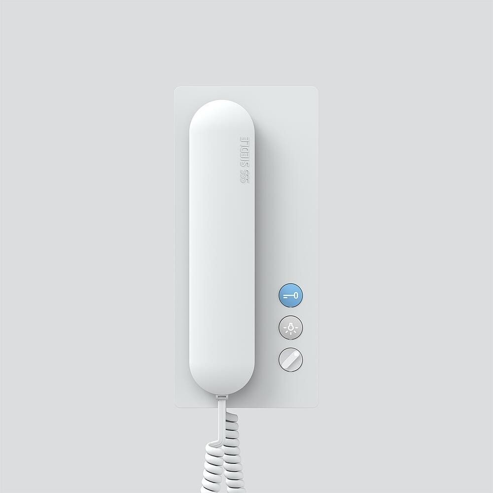 Un modulo citofono Siedle bianco con tre pulsanti su sfondo grigio chiaro.