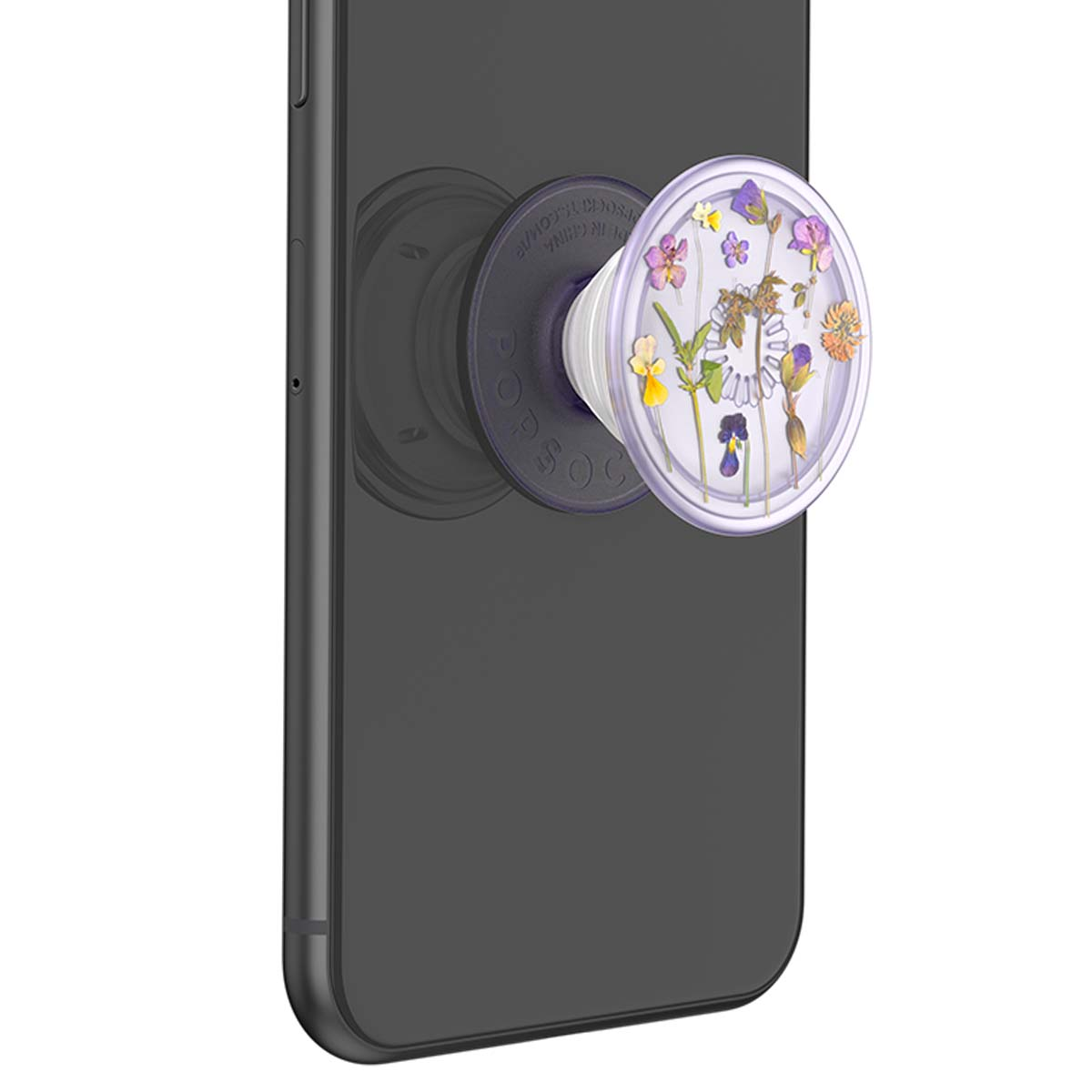 Un agarre transparente para teléfono con flores prensadas en morado, amarillo y rosa.