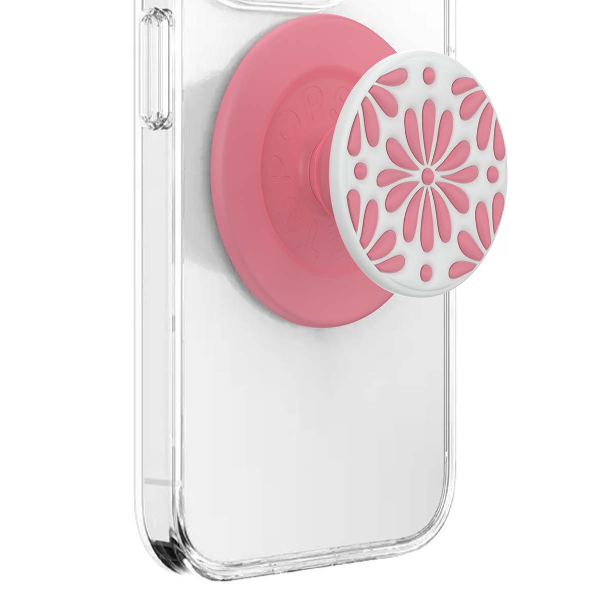 Un agarre PopSockets rosa con patrón floral blanco en una funda de teléfono transparente.