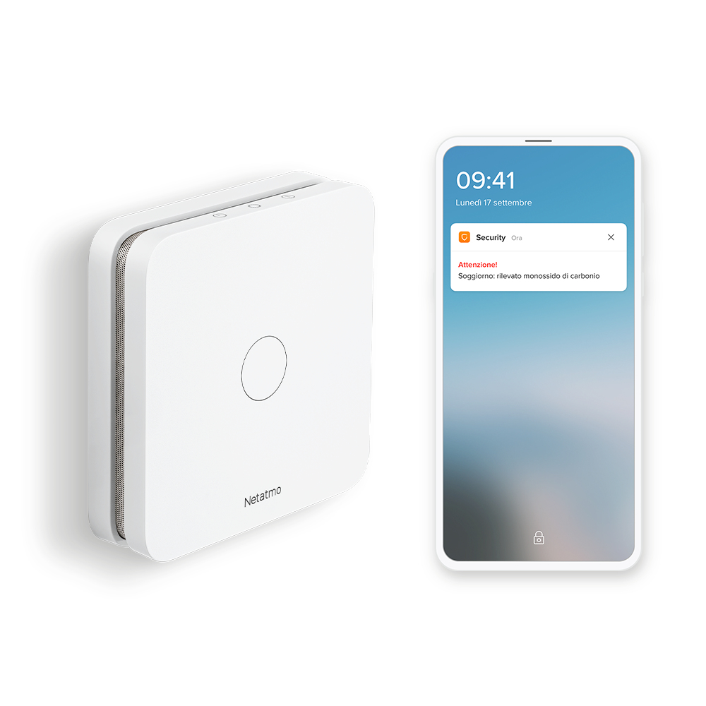 Ein weißes Netatmo-Gerät und ein Smartphone mit Kohlenmonoxidwarnung.
