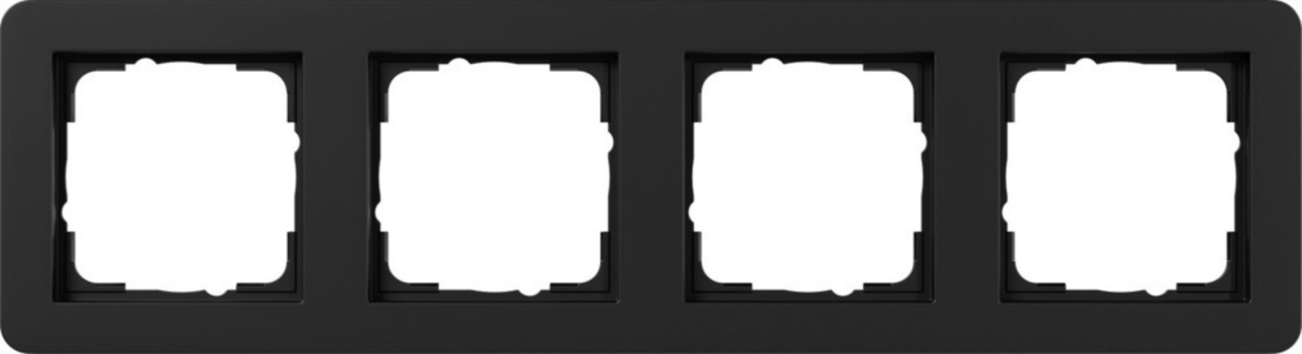 Una cornice nera con quattro aperture quadrate vuote per interruttori.