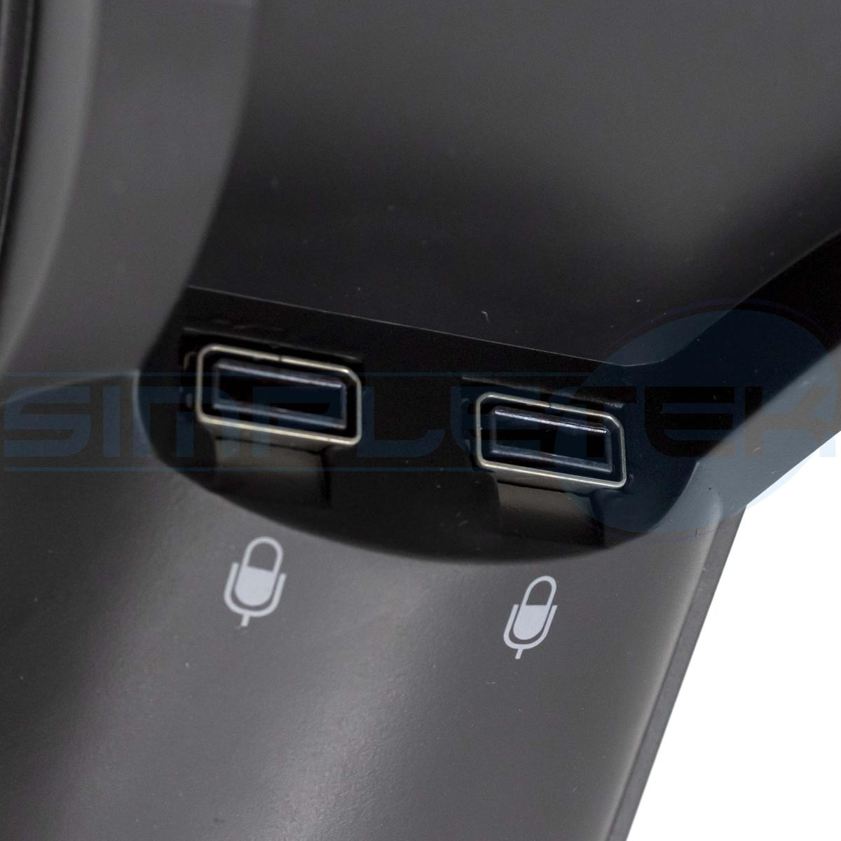 Due porte USB e due icone microfono su un dispositivo elettronico nero.