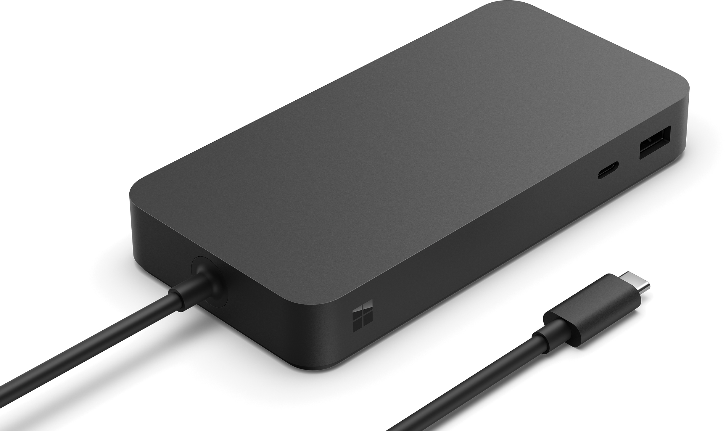 Eine schwarze Microsoft Surface Dock mit USB-C-Kabel auf weißem Hintergrund.