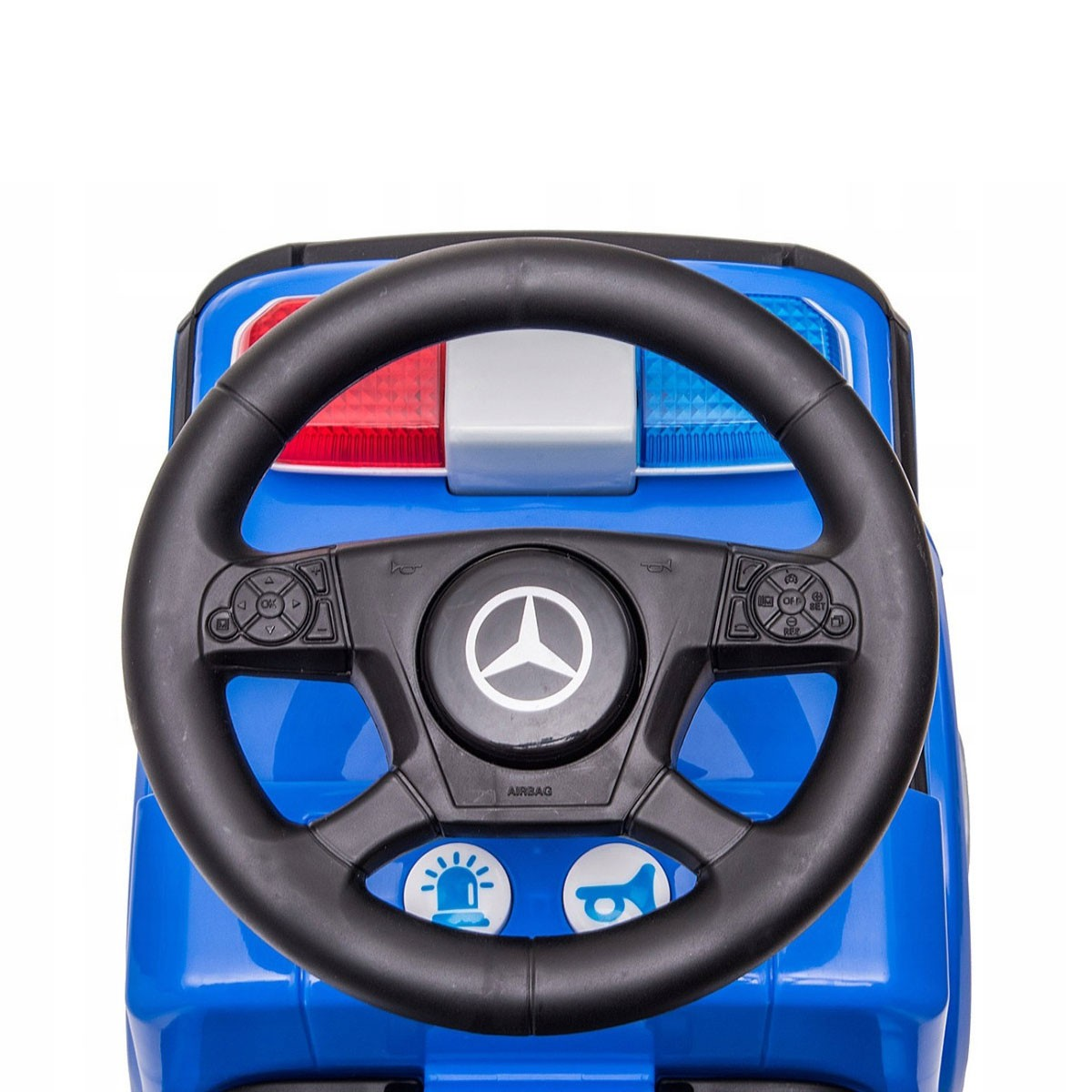 Cruscotto auto della polizia giocattolo blu con volante nero, logo Mercedes e luci lampeggianti.