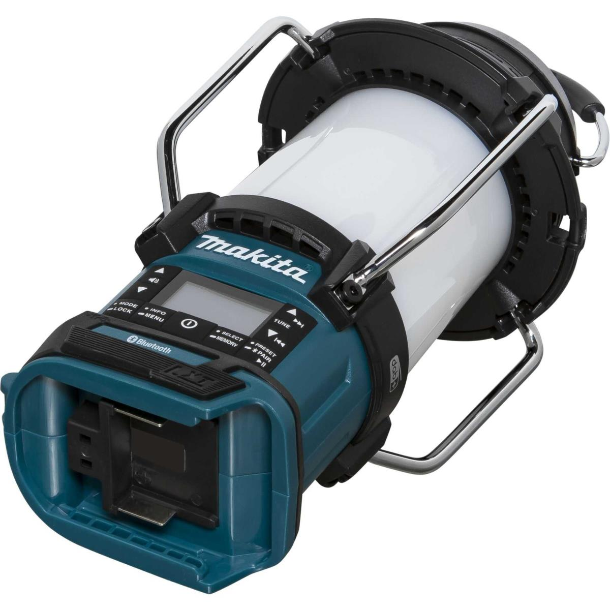 Lanterne Makita avec Bluetooth et radio DAB, avec un cylindre blanc et une base turquoise.