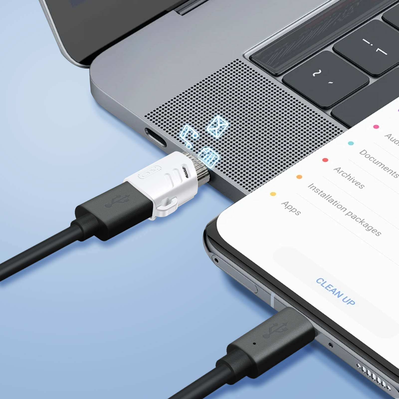 Un cavo USB-C collega uno smartphone a un laptop, trasferendo dati.