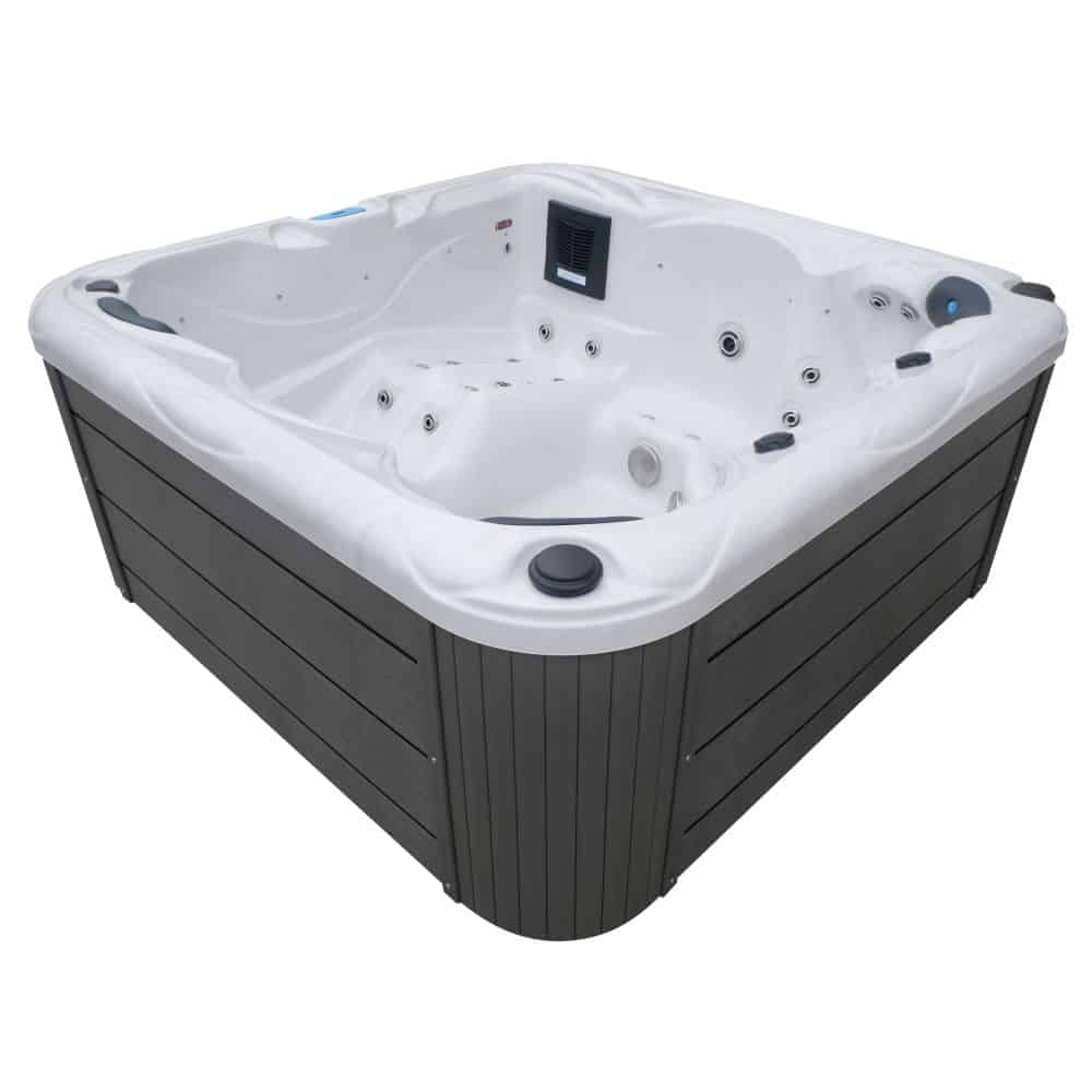 Un jacuzzi blanco con exterior de lamas gris oscuro y múltiples chorros.