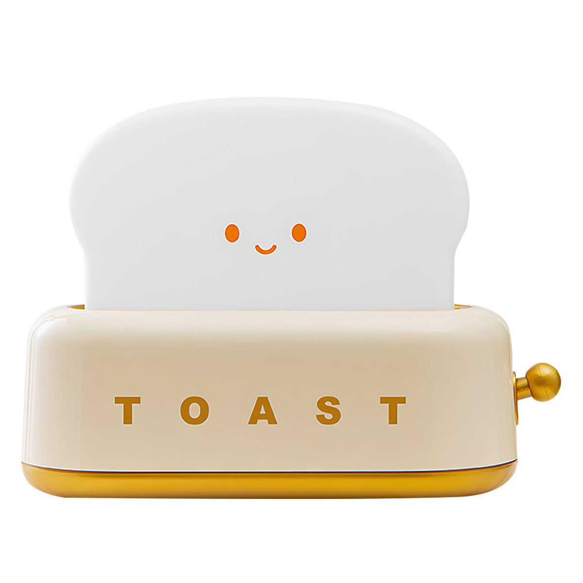 Eine niedliche, cremefarbene Lampe in Toasterform mit einem lachenden Gesicht.