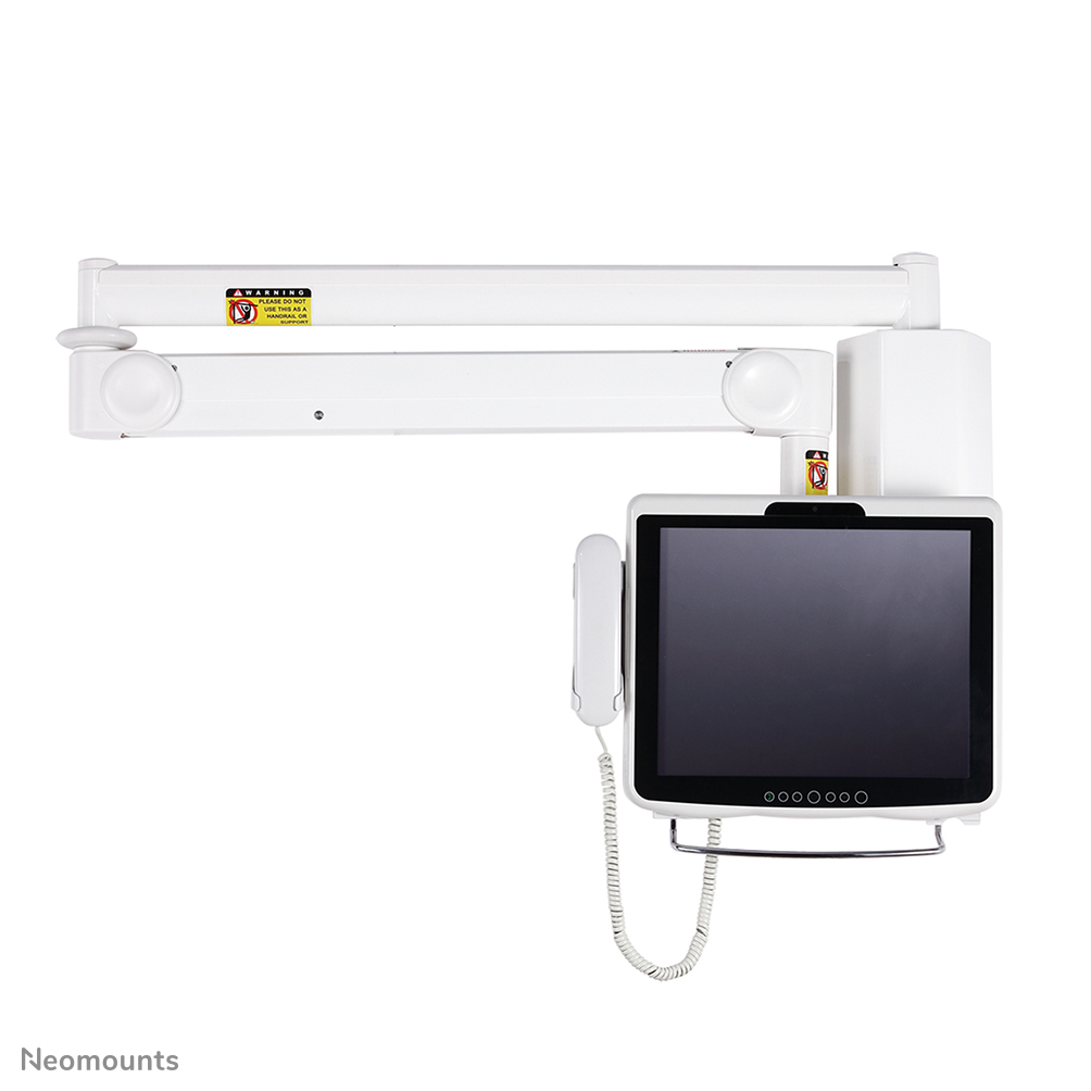 A white medical monitor arm with a screen and phone attached. Warning labels are visible.