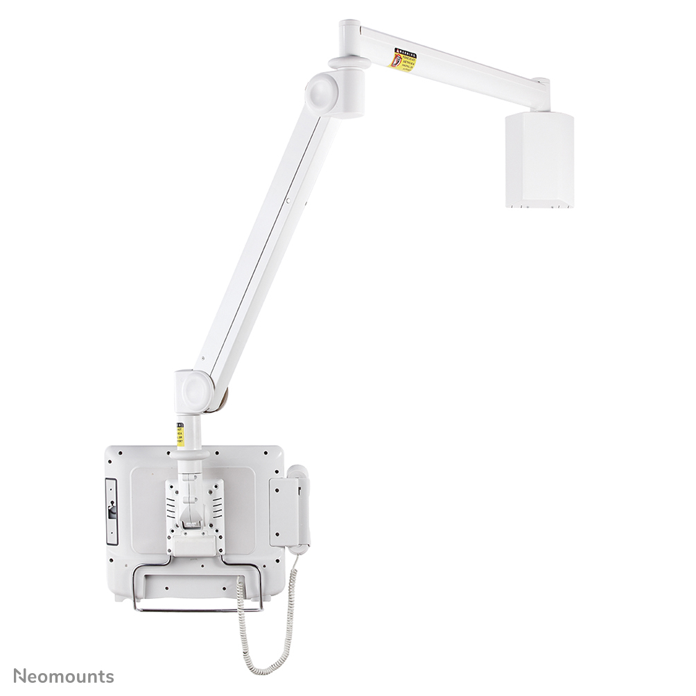 A white medical monitor arm with a screen and handset attached, mounted on a wall.