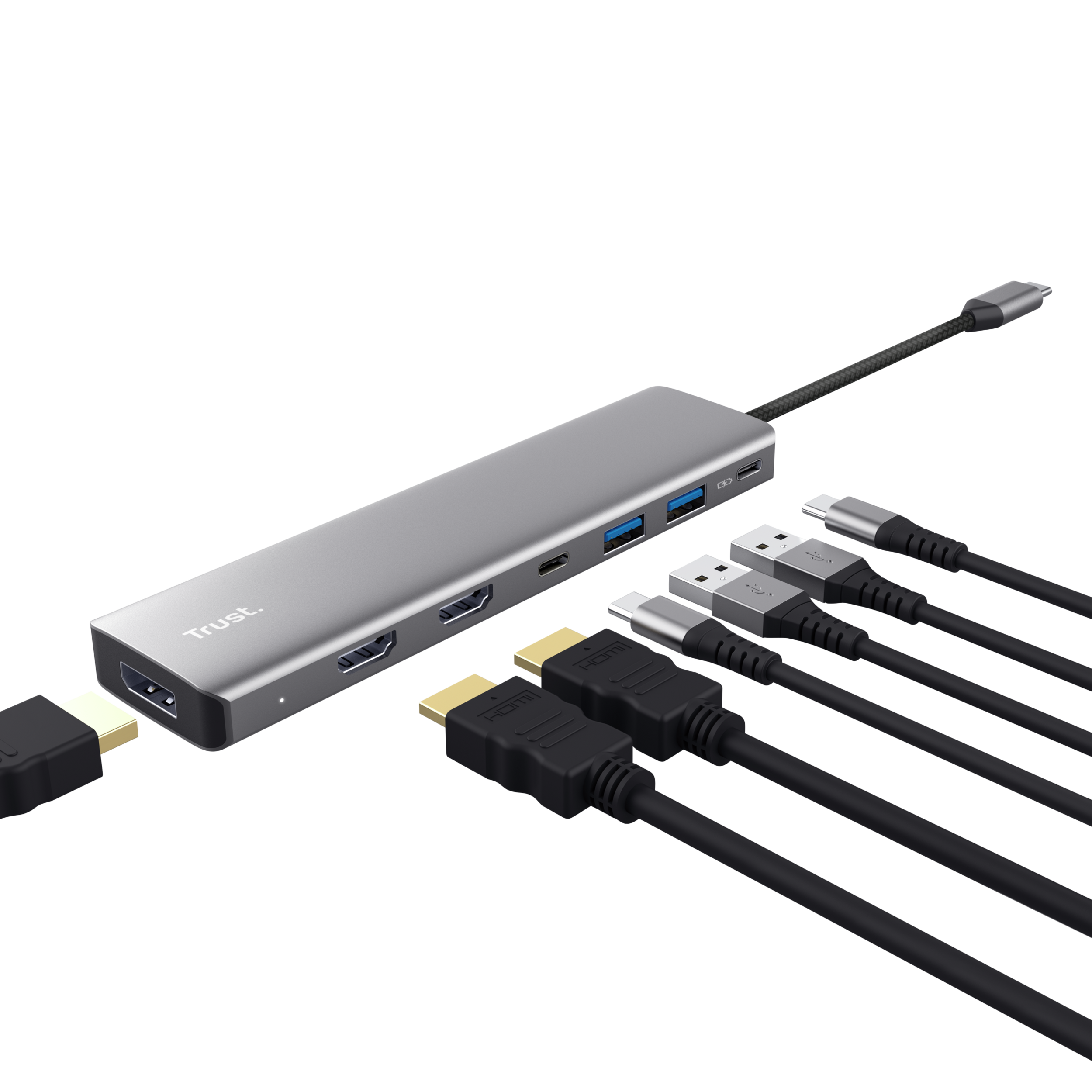 Hub USB-C argentato Trust con porte HDMI, USB-A e USB-C, con cavi.