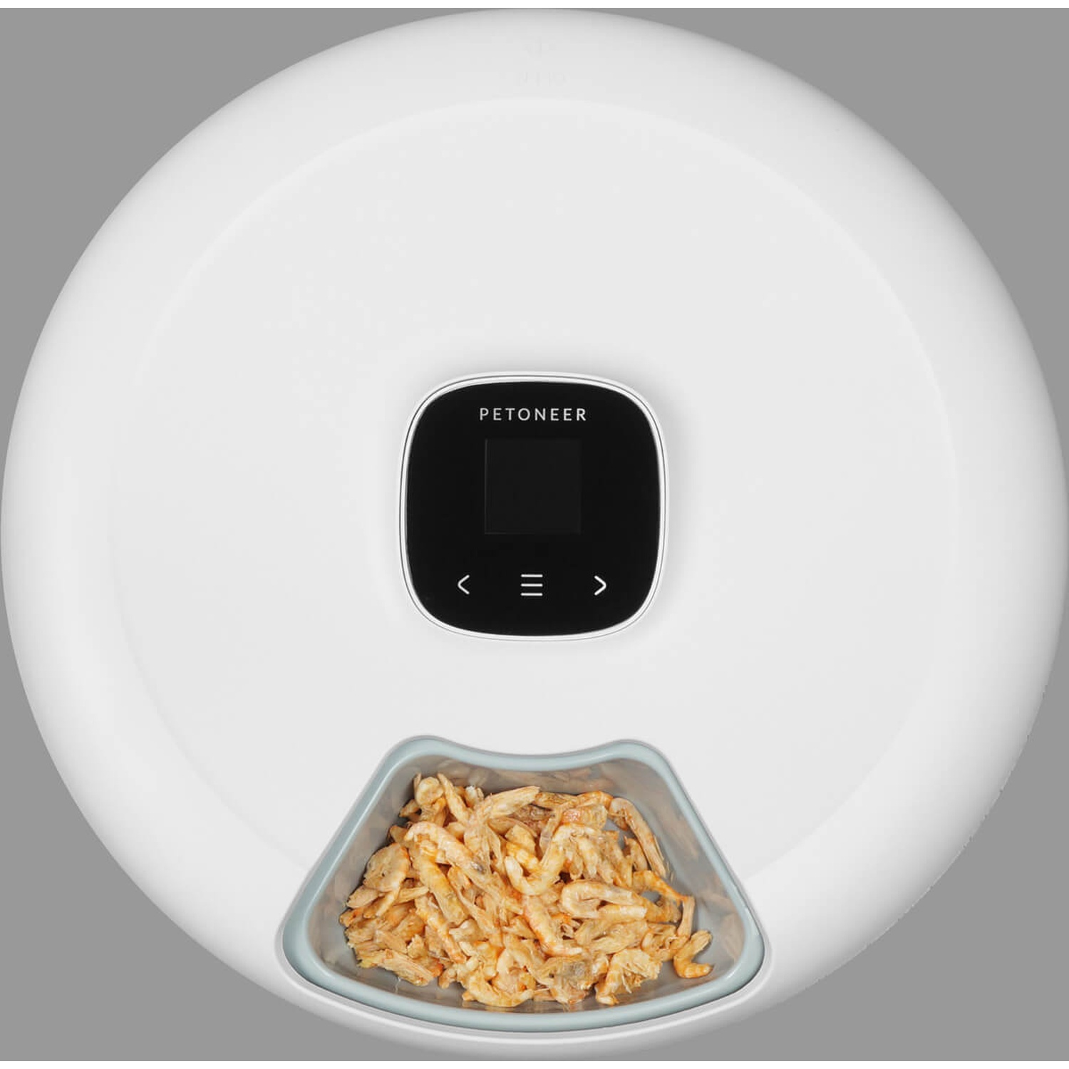Biały automatyczny karmnik dla zwierząt z czarnym wyświetlaczem i miską suszonych krewetek.