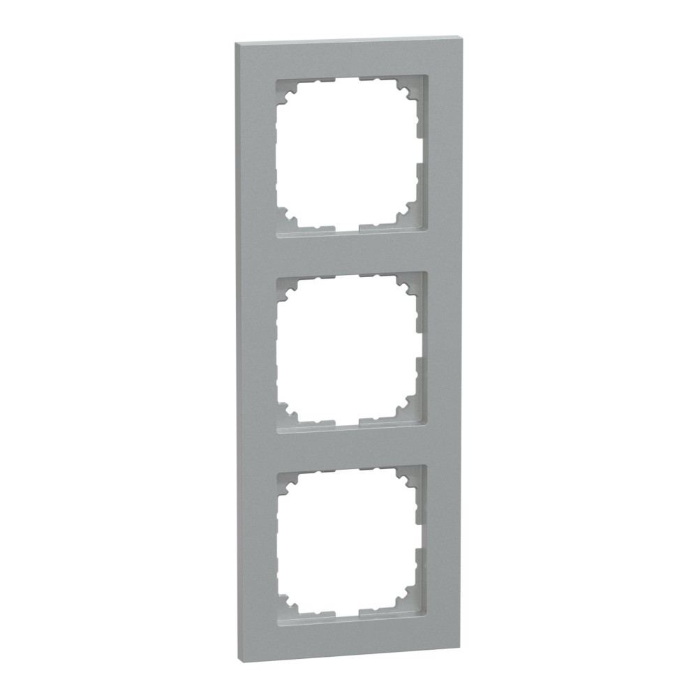 Una cornice modulare grigio chiaro a tre posti per interruttori su sfondo bianco.