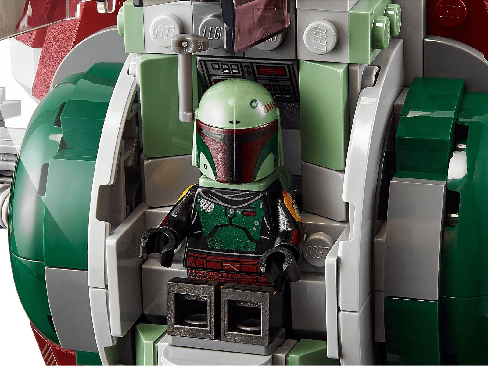 Personaggio Lego Boba Fett in una cabina di pilotaggio verde e grigia con accenti rossi.
