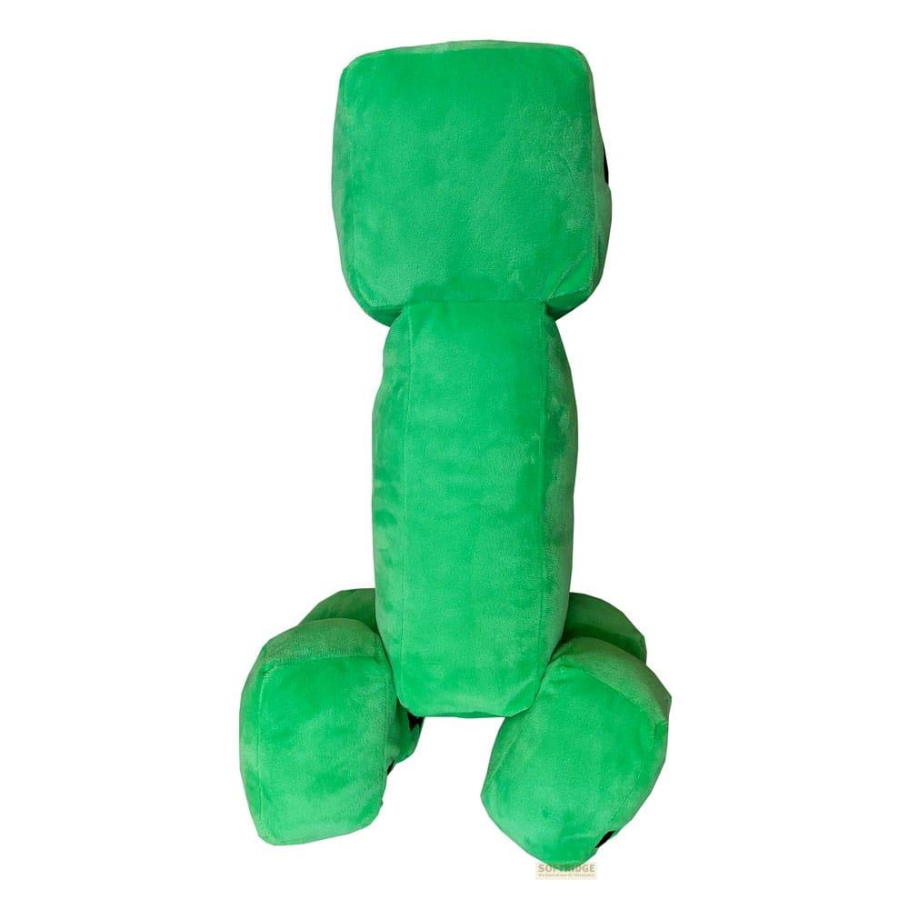 Ein grünes Minecraft Creeper-Plüschtier steht aufrecht mit seinen Armen und Beinen ausgestreckt.