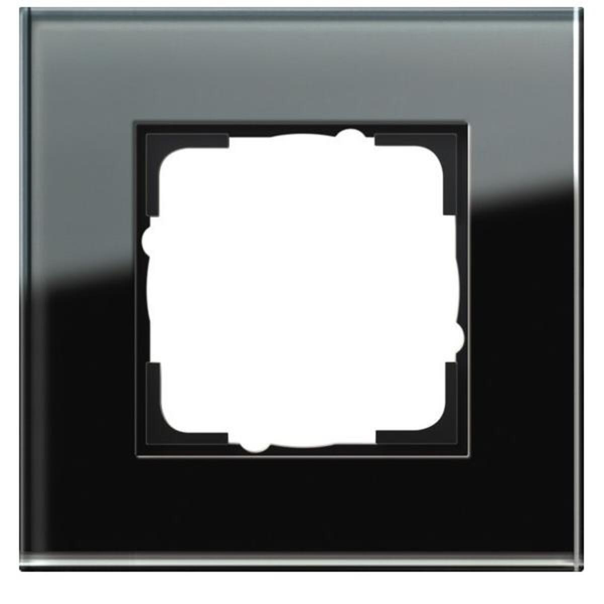 Una moderna cornice per interruttore in vetro nero con ritaglio bianco.