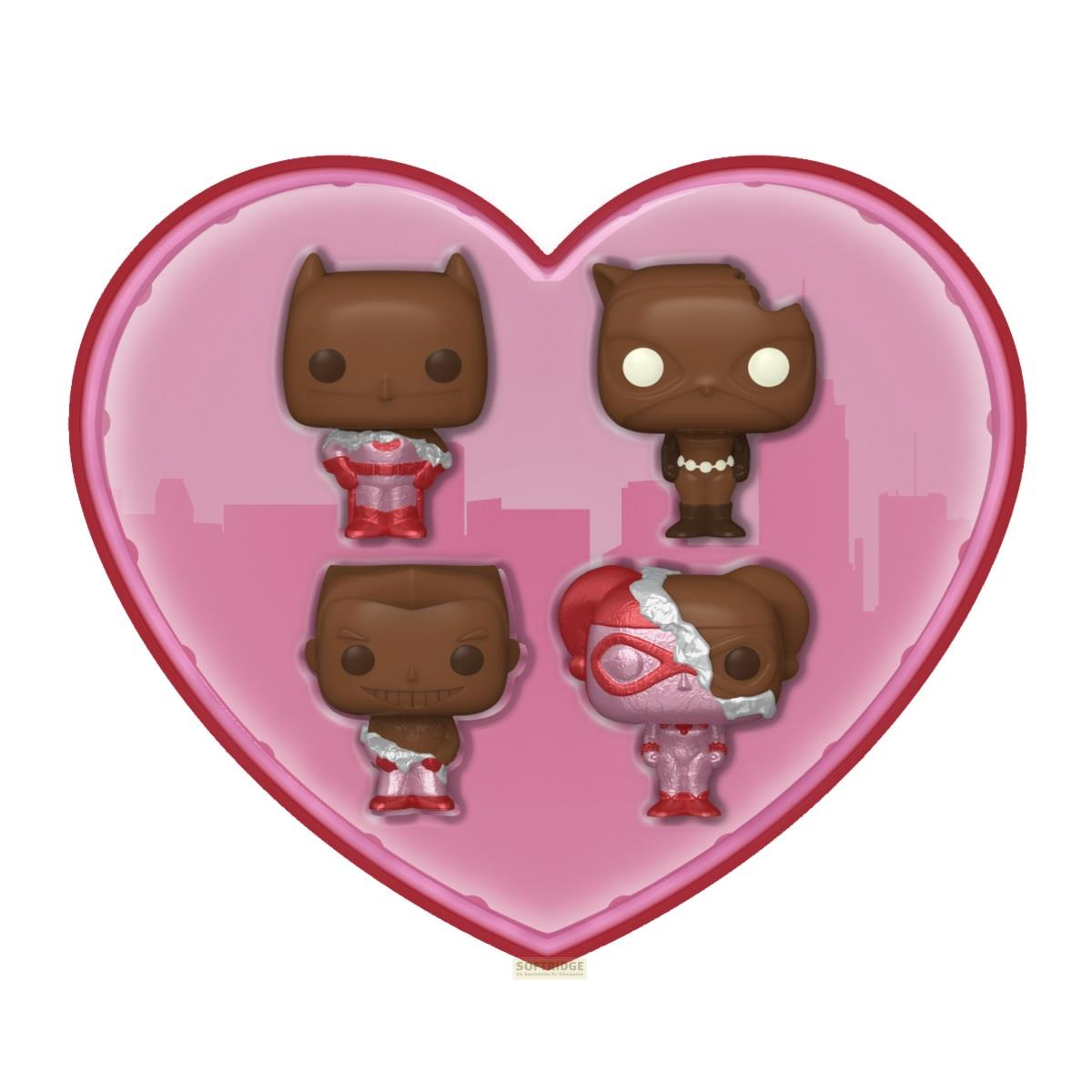 Cuatro Funko Pops color chocolate en una caja rosa en forma de corazón con fondo de ciudad.