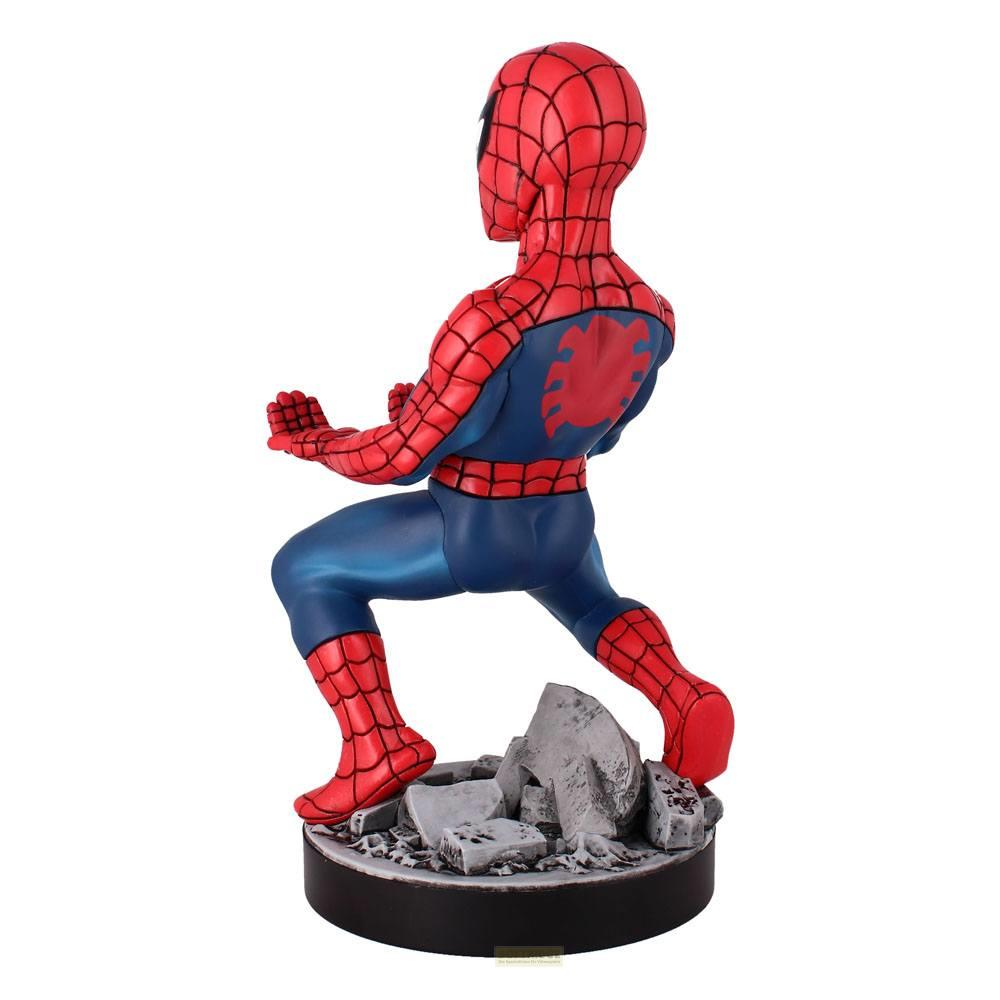 Statua di Spiderman in costume rosso e blu, accovacciato su una base di macerie.