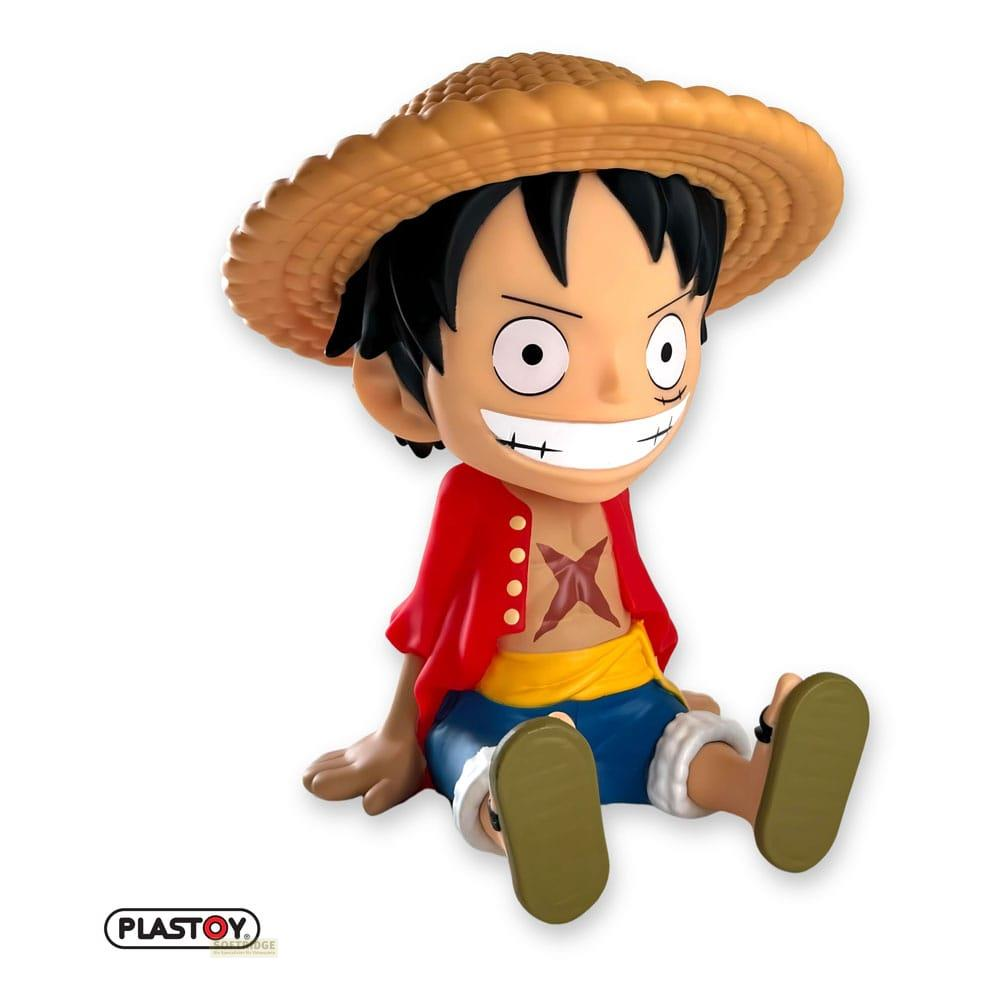 Una figura de dibujos animados de Monkey D. Luffy de One Piece, con sombrero de paja y chaqueta roja.