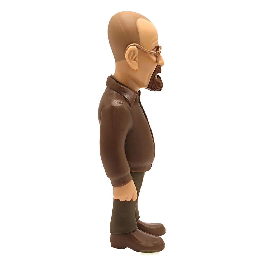 Una figura de cabeza de serpiente marrón de un hombre calvo con gafas y barba.