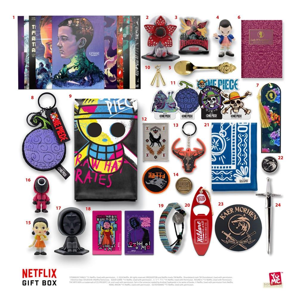 Scatola regalo Netflix con merchandising di Stranger Things, One Piece, Squid Game e Witcher.