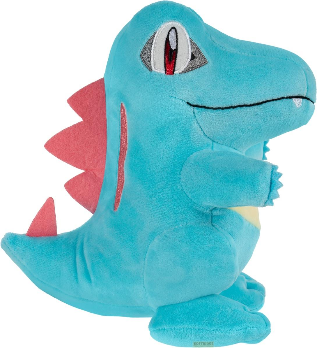 Ein blauer Plüsch-Krokilius mit roten Stacheln auf Rücken und Schwanz, und Gelb am Bauch.
