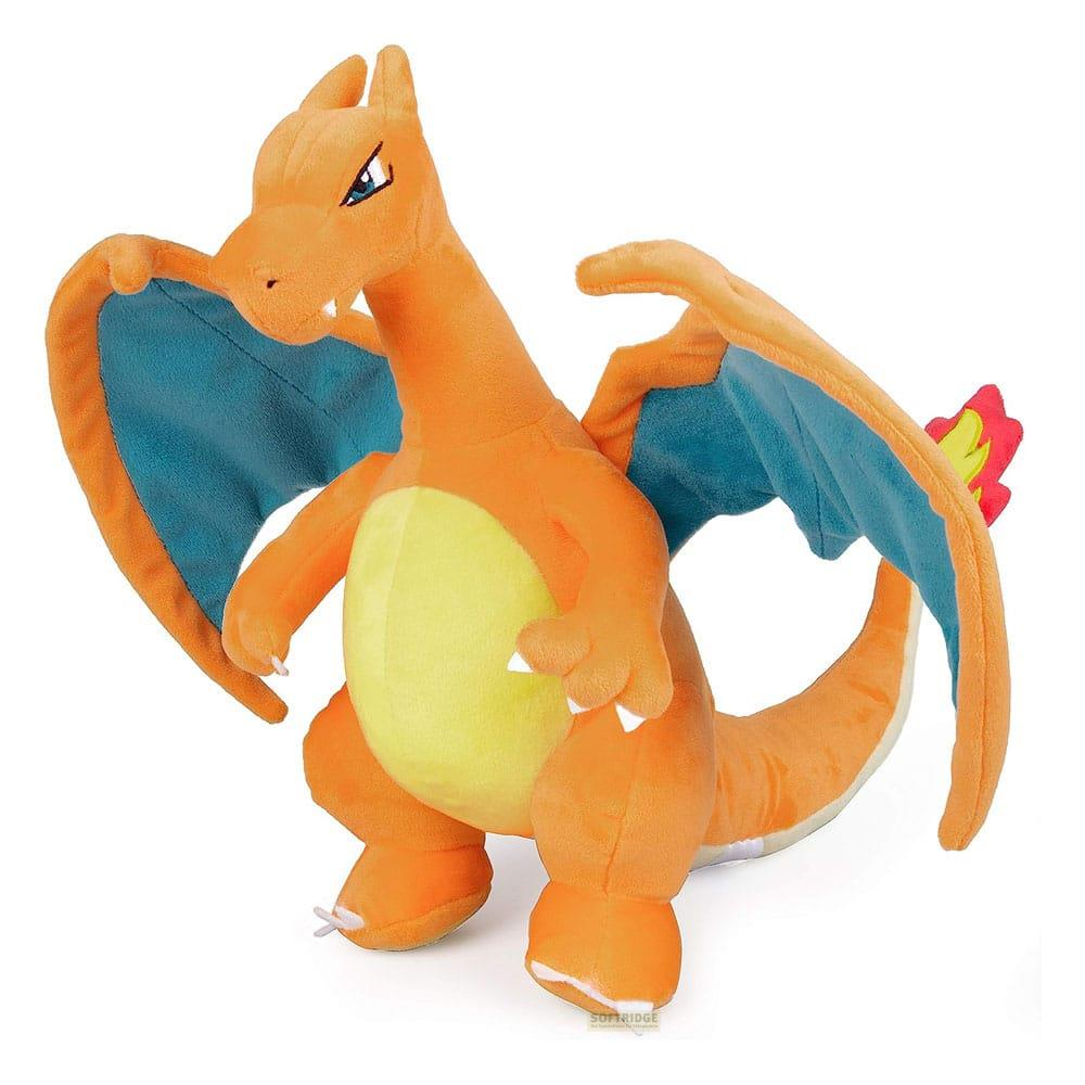 Drago di peluche arancione con ali blu e pancia gialla, su sfondo bianco.